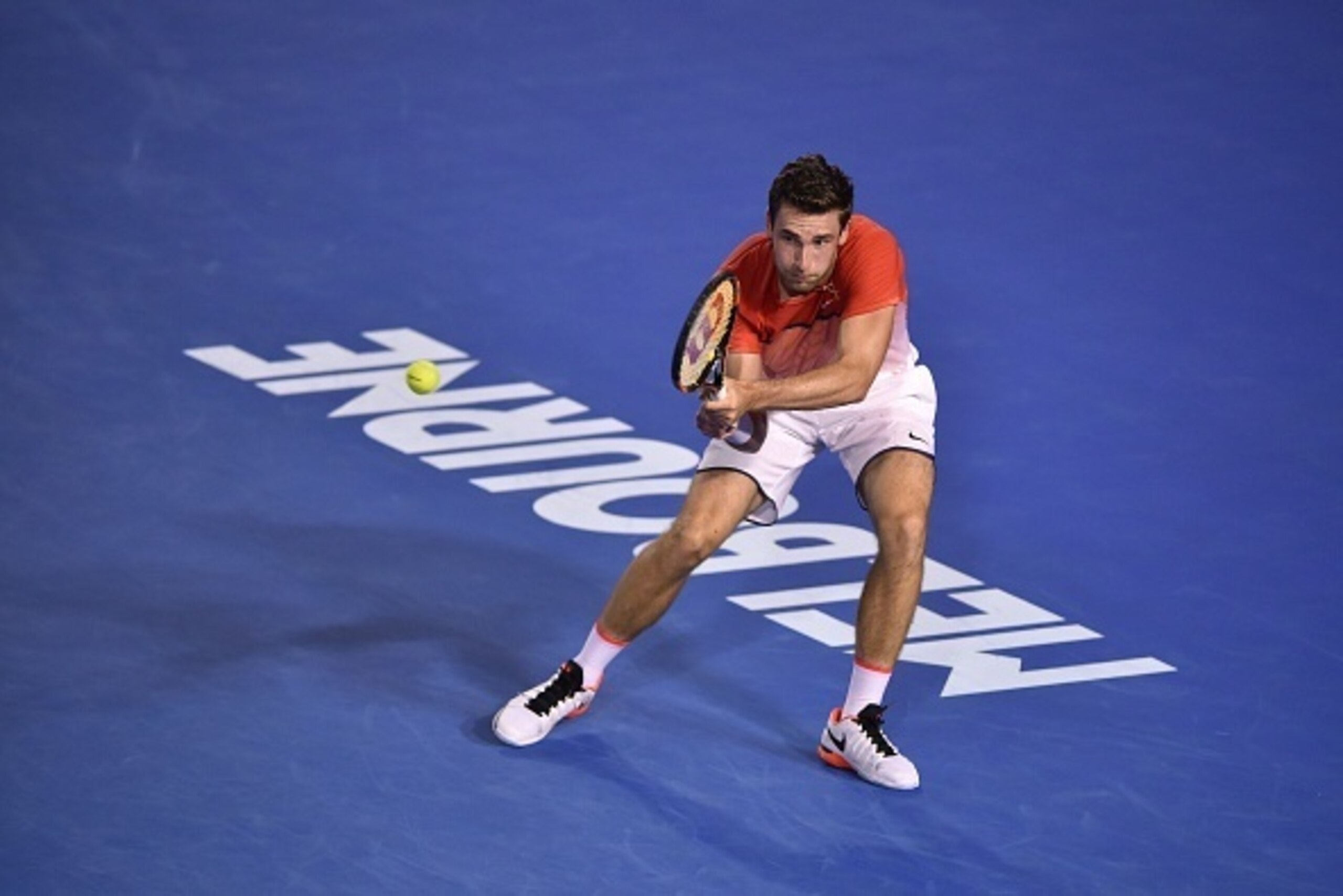 France's Quentin Halys plays a backhand return during men's singles match against Serbia's Novak Djokovic on day three of the 2016 Australian Open tennis tournament in Melbourne on January 20, 2016. AFP PHOTO / PETER PARKS-- IMAGE RESTRICTED TO EDITORIAL 