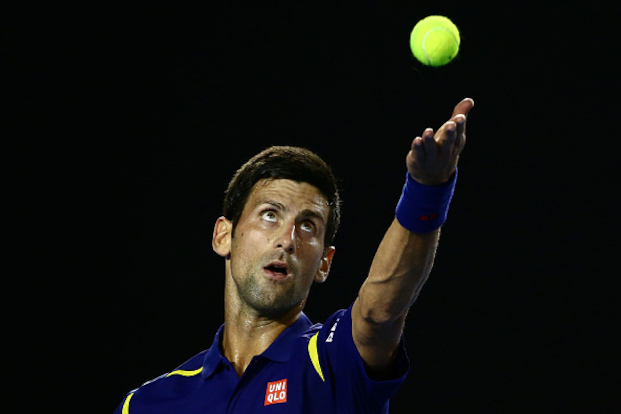 MELBOURNE, AUSTRALIA - JANUARY 20:  Novak Djokovic of Serbia serves in his second round match against Quentin Halys of France during day three of the 2016 Australian Open at Melbourne Park on January 20, 2016 in Melbourne, Australia.  (Photo by Scott Barb