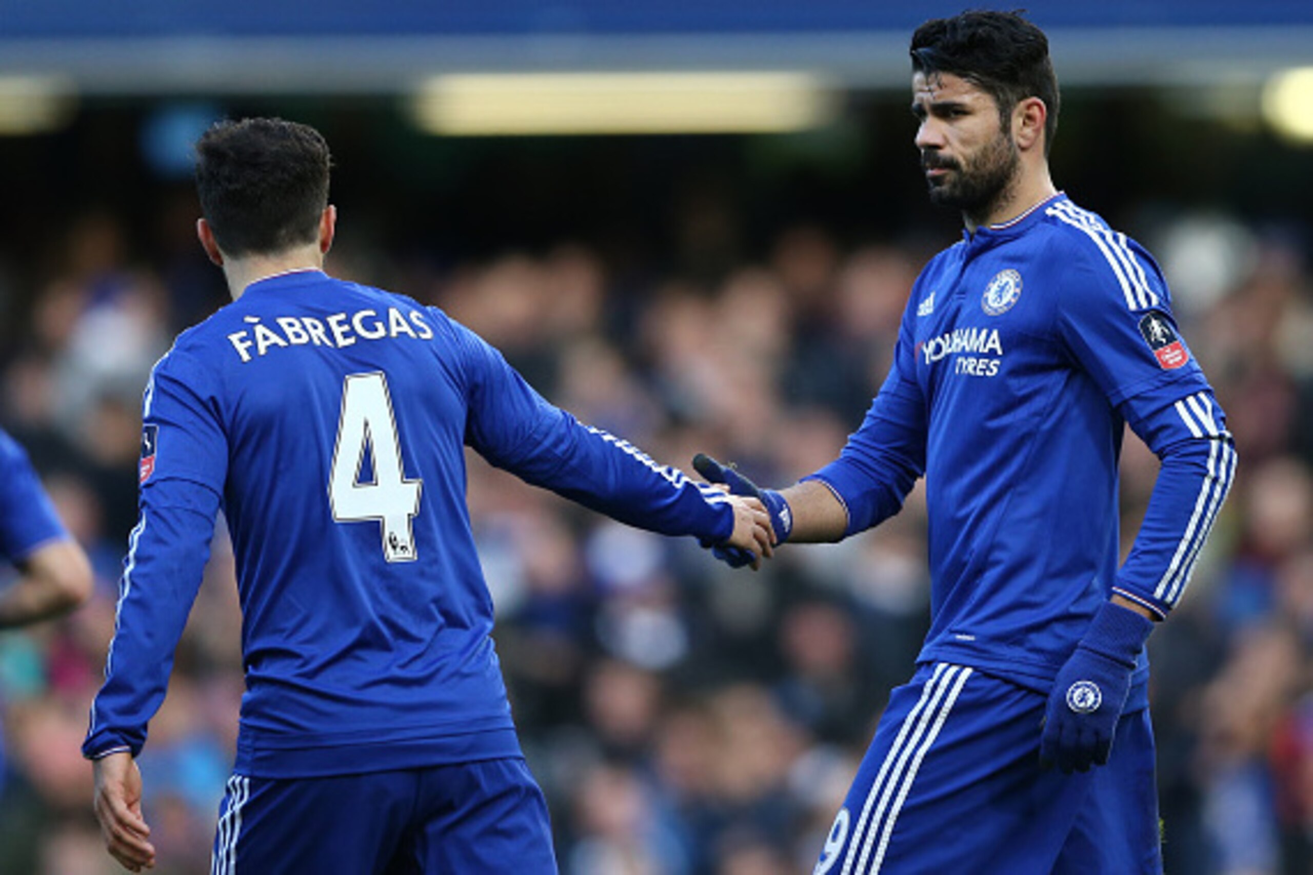 Chelsea's Brazilian-born Spanish striker Diego Costa (R) celebrates with Chelsea's Spanish midfielder Cesc Fabregas after scoring his team's first goal during the FA Cup third-round football match between Chelsea and Scunthorpe United at Stamford Bridge i