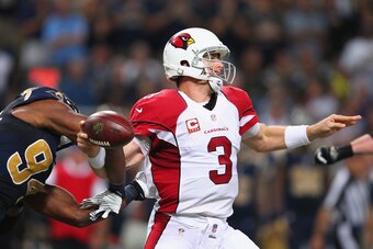 ST. LOUIS, MO - SEPTEMBER 8: Robert Quinn #94 of the St. Louis Rams causes Carson Palmer #3 of the Arizona Cardinals to fumble the ball at the Edward Jones Dome on September 8, 2013 in St. Louis, Missouri.  The Rams beat the Cardinals 27-24.  (Photo by Di