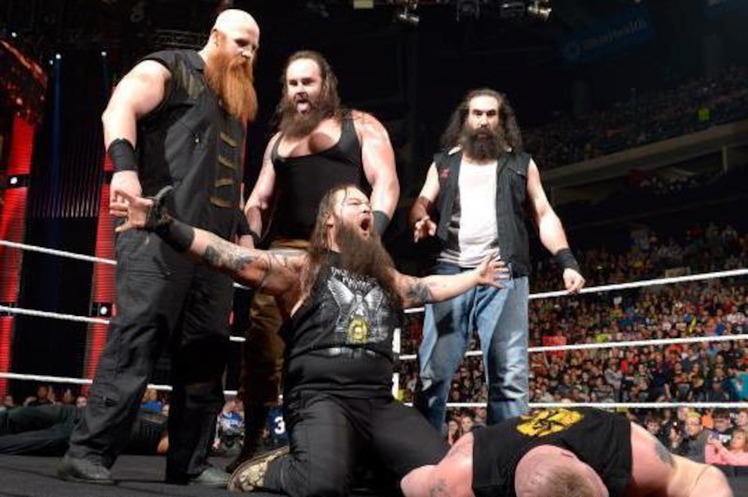 The Wyatt Family gloat over a fallen Brock Lesnar.