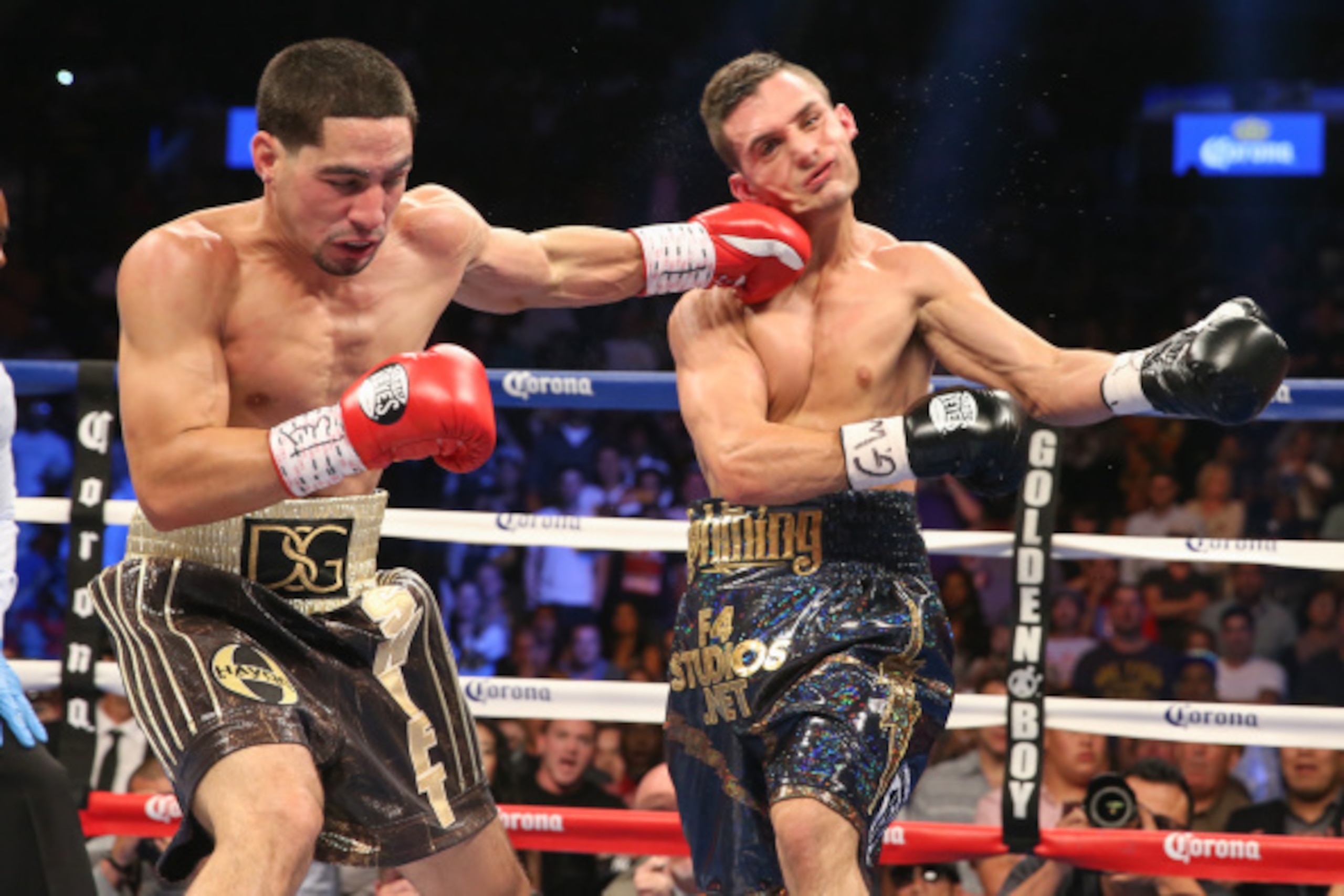 BROOKLYN, NY - AUGUST 9: Danny Garcia (Brown/Gold trunks) lands a left hook to the head of Rod Salka (Black/Gold trunks) during their fight at the Barclays Center on August 9, 2014 in Brooklyn, New York. (Photo by Ed Mulholland/Getty Images)