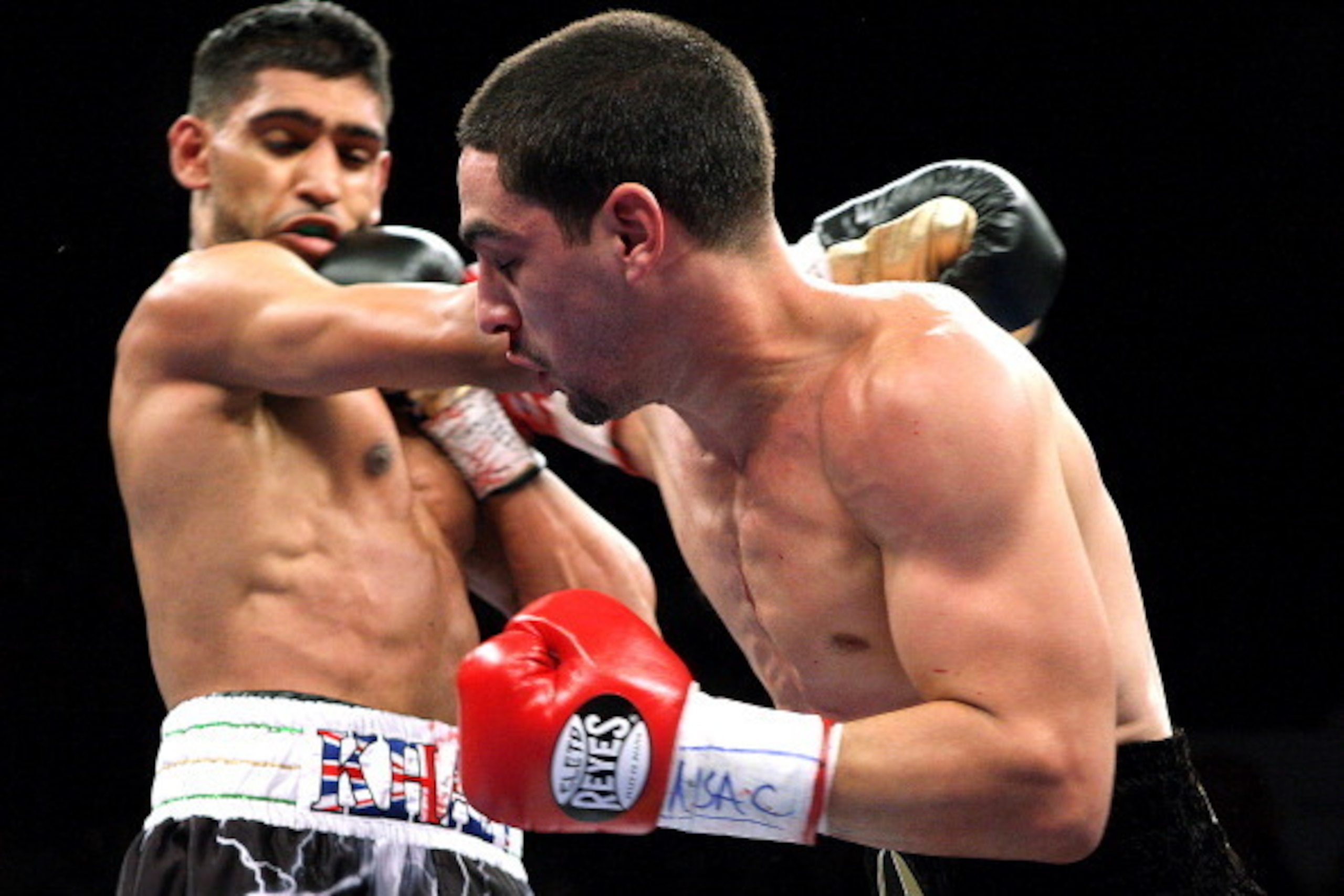 Danny Garcia (R) from Philadelphia, Pennsylvania, trades punches with Amir Khan, from Bolton, England on July 14, 2012  at the Mandalay Bay Events Center in Las Vegas, Nevada.  Garcia defeated Khan with a TKO in the fourth round, claiming the WBC and WBA 