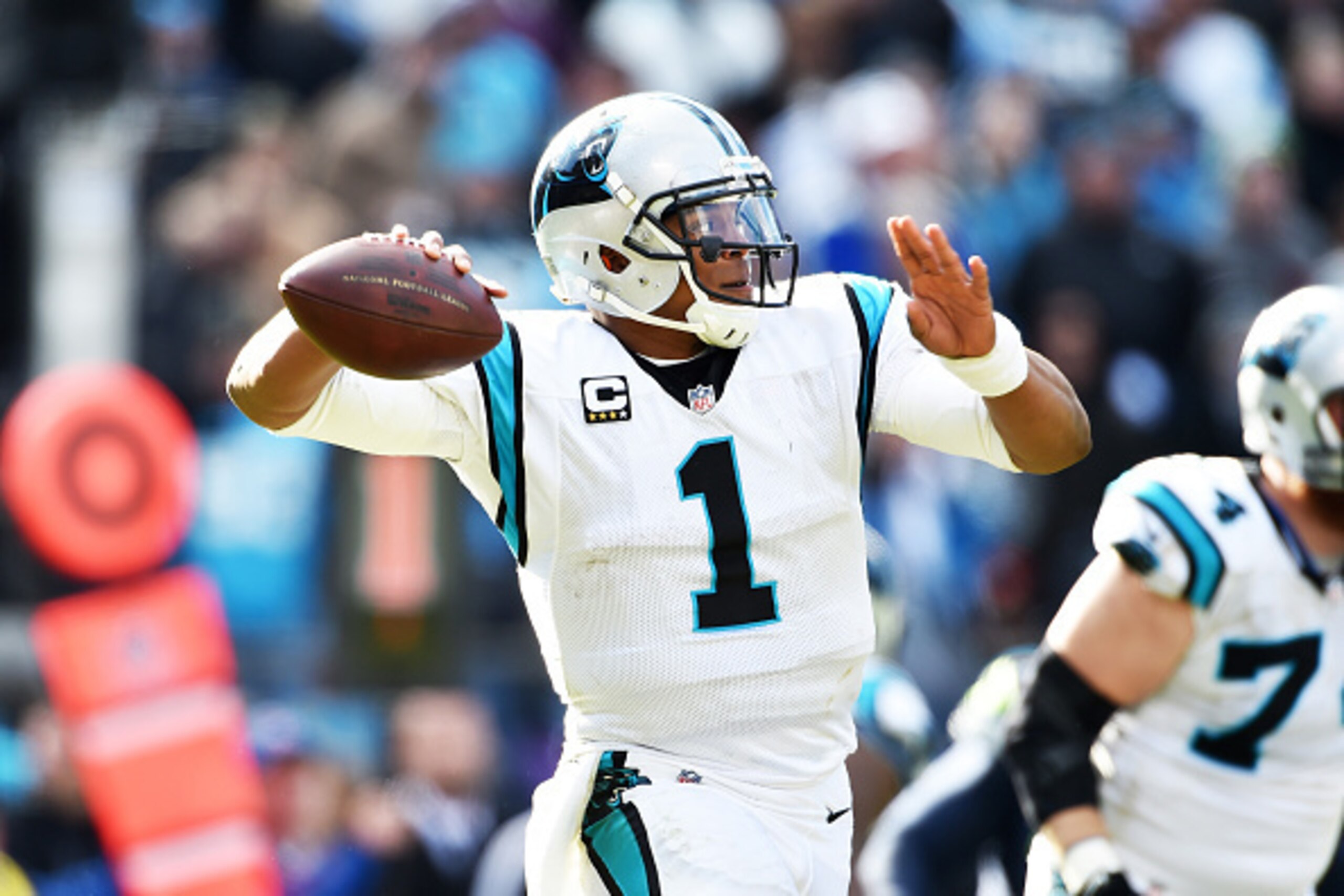 CHARLOTTE, NC - JANUARY 17:  Quarterback Cam Newton #1 of the Carolina Panthers passes during the NFC Divisional Playoff Game against the Seattle Seahawks at Bank of America Stadium on January 17, 2016 in Charlotte, North Carolina. (Photo by Ronald C. Mod