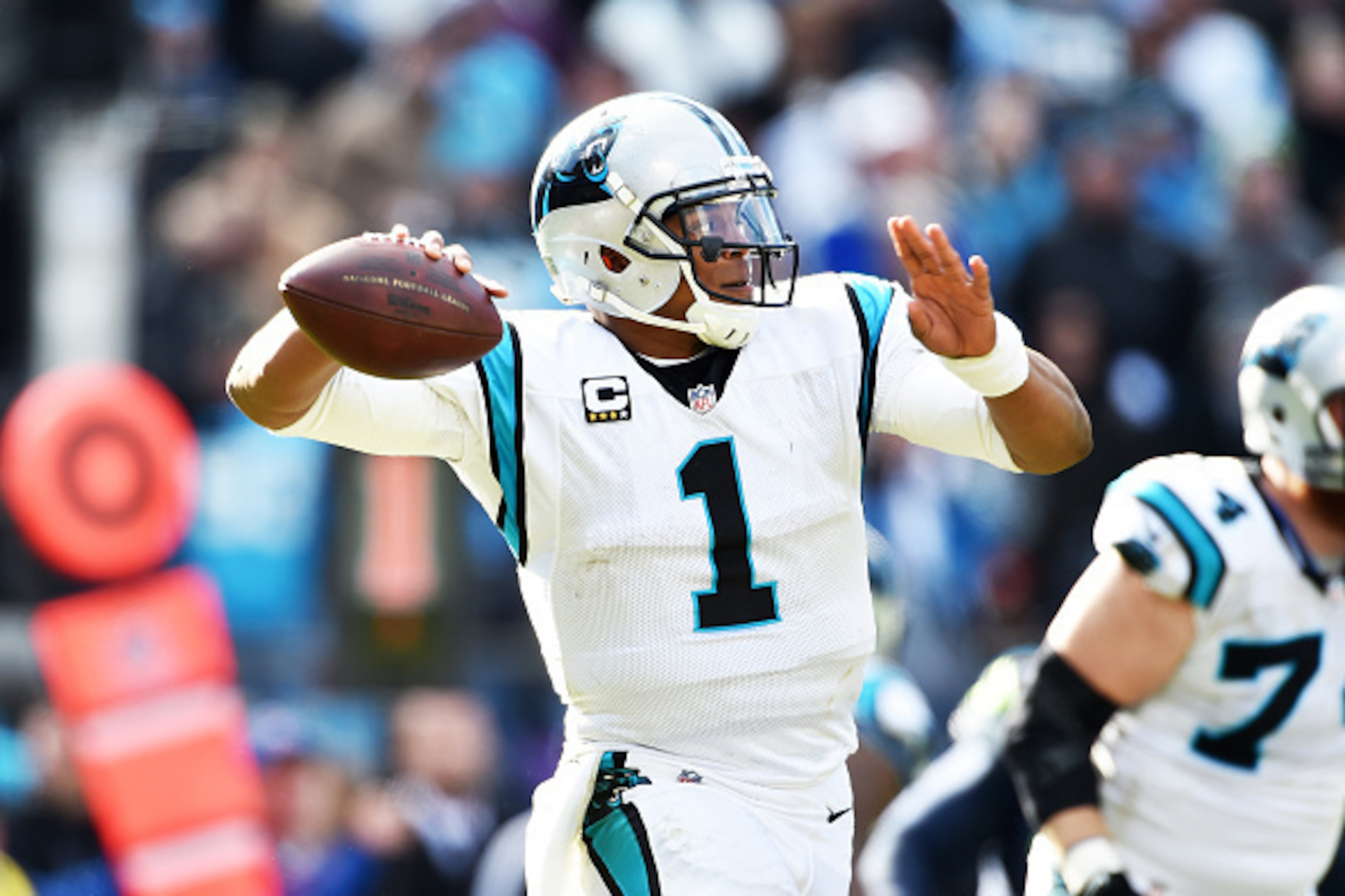 CHARLOTTE, NC - JANUARY 17: Quarterback Cam Newton #1 of the Carolina Panthers passes during the NFC Divisional Playoff Game against the Seattle Seahawks at Bank of America Stadium on January 17, 2016 in Charlotte, North Carolina. (Photo by Ronald C. Mod CHARLOTTE, NC - JANUARY 17: Quarterback Cam Newton #1 of the Carolina Panthers passes during the NFC Divisional Playoff Game against the Seattle Seahawks at Bank of America Stadium on January 17, 2016 in Charlotte, North Carolina. (Photo by Ronald C. Mod