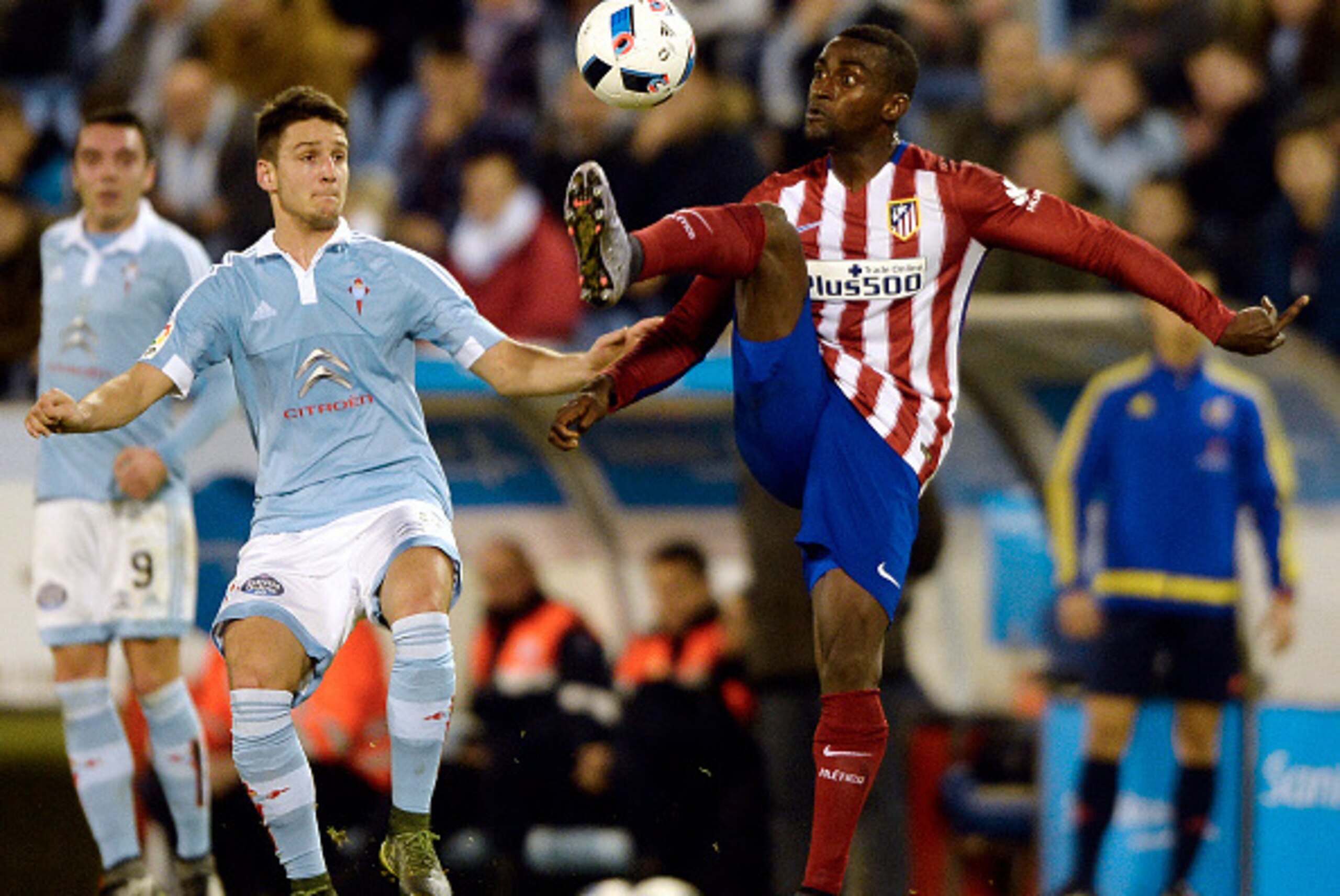 Atletico Madrid's Colombian forward Jackson Martinez (R) vies with Celta Vigo's Serbian midfielder Nemanja Radoja during the Spanish Copa del Rey (King's Cup) football match Celta Vigo vs Club Atletico de Madrid at the Balaidos stadium in Vigo on January 
