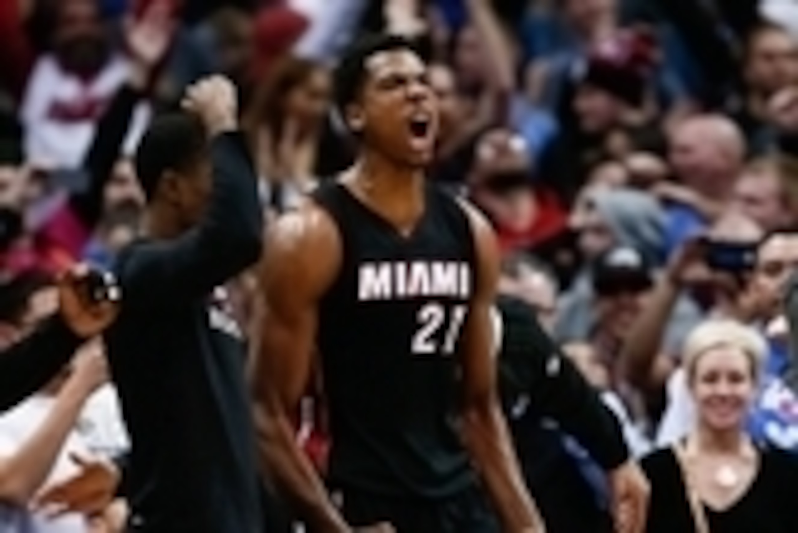 Jan 15, 2016; Denver, CO, USA; Miami Heat center Hassan Whiteside (21) celebrates after the buzzer sounds in the fourth quarter against the Denver Nuggets at the Pepsi Center. The Heat defeated the Nuggets 98-95. Mandatory Credit: Isaiah J. Downing-USA TO