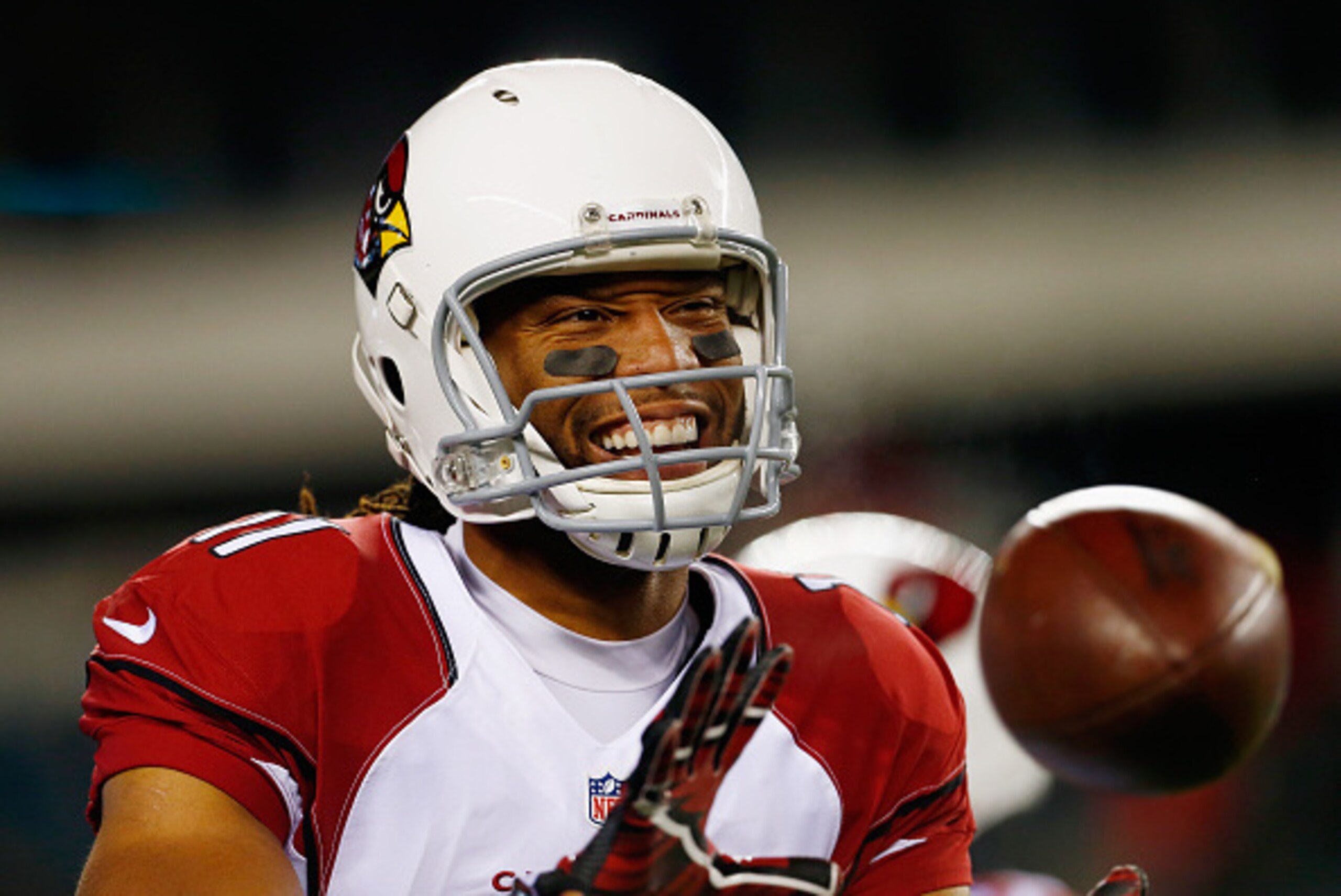 PHILADELPHIA, PA - DECEMBER 20: Larry Fitzgerald #11 of the Arizona Cardinals smiles as he catches the ball before the game against the Philadelphia Eagles at Lincoln Financial Field on December 20, 2015 in Philadelphia, Pennsylvania.  (Photo by Rich Schu