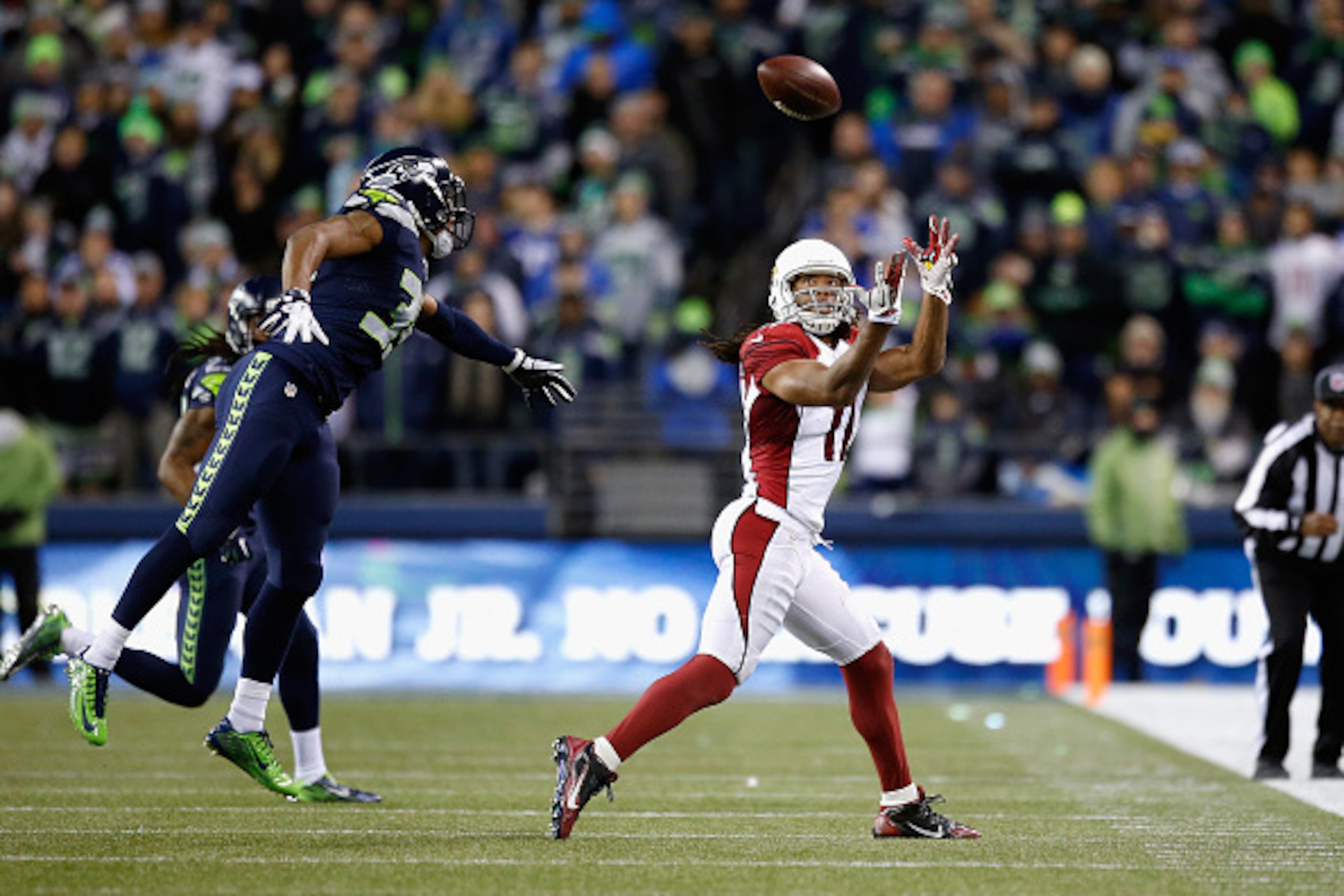 SEATTLE, WA - NOVEMBER 15:  Larry Fitzgerald #11 of the Arizona Cardinals attempts to catch a pass during the first half against the Seattle Seahawks at CenturyLink Field on November 15, 2015 in Seattle, Washington.  (Photo by Otto Greule Jr/Getty Images)