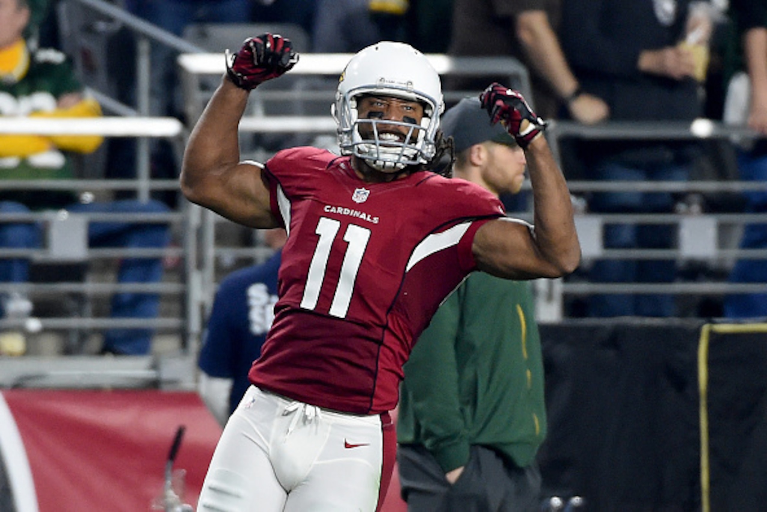 GLENDALE, AZ - JANUARY 16:  Wide receiver Larry Fitzgerald #11 of the Arizona Cardinals reacts after making a catch during the third quarter of the NFC Divisional Playoff Game at University of Phoenix Stadium on January 16, 2016 in Glendale, Arizona.  (Ph