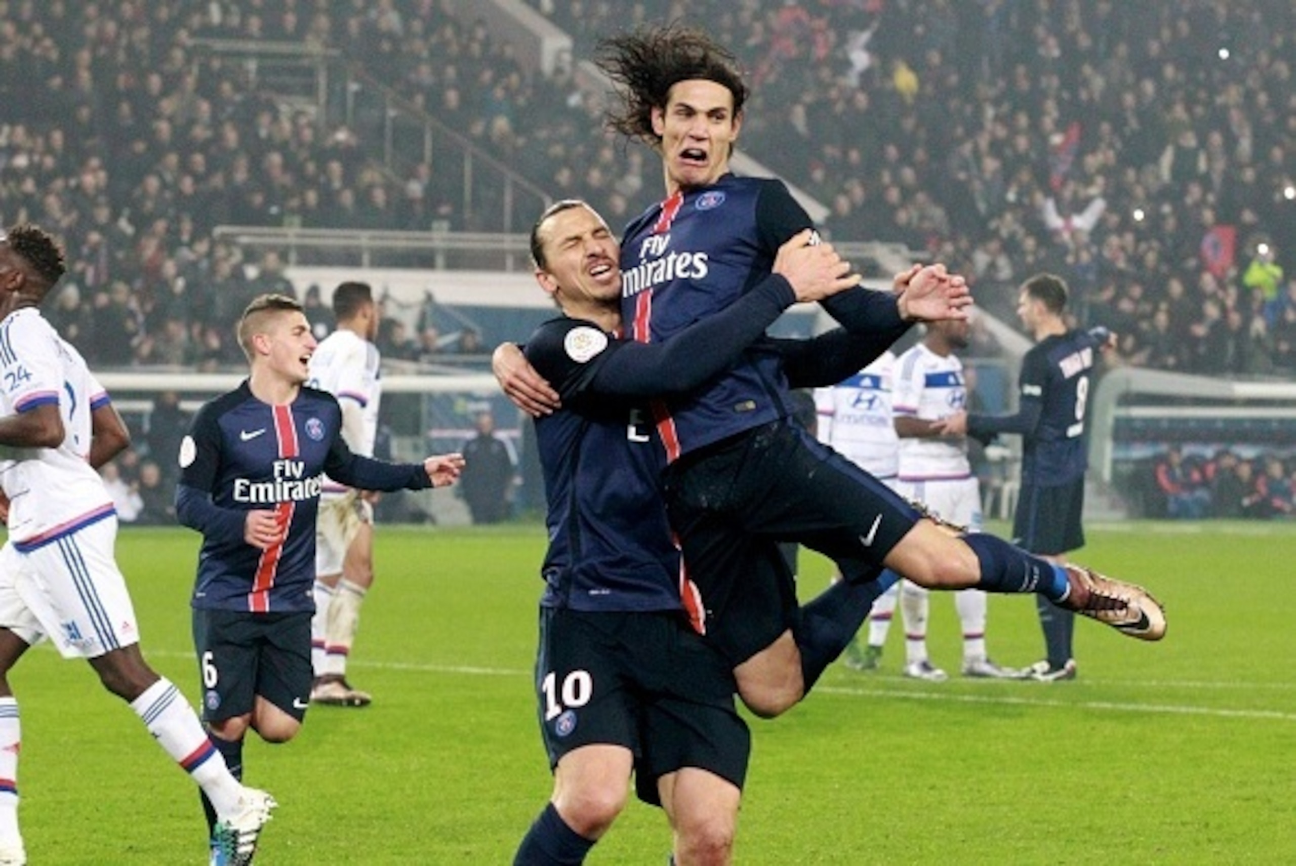 PARIS, FRANCE - DECEMBER 13: Zlatan Ibrahimovic of Paris Saint-Germain celebrate his second goal with Edinson Cavani during the French  Ligue 1 between Paris Saint-Germain and Olympique Lyonnais at Parc Des Princes on december 13, 2015 in Paris, France.  