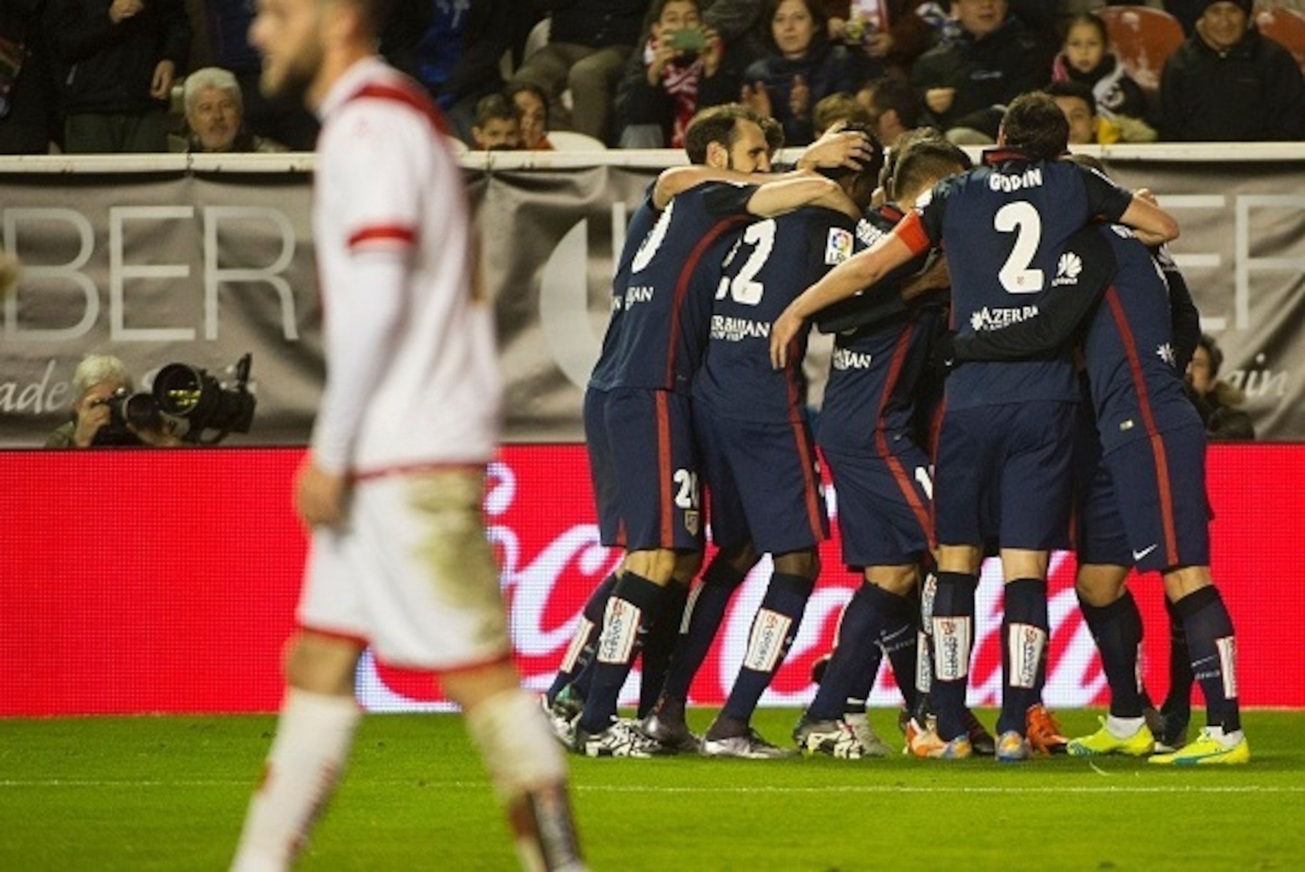 Atletico Madrid players celebrate after scoring their second goal during the Spanish league football match Rayo Vallecano de Madrid vs Club Atletico de Madrid at Vallecas stadium in Madrid on December 30, 2015. AFP PHOTO/ CURTO DE LA TORRE / AFP / CURTO Atletico Madrid players celebrate after scoring their second goal during the Spanish league football match Rayo Vallecano de Madrid vs Club Atletico de Madrid at Vallecas stadium in Madrid on December 30, 2015. AFP PHOTO/ CURTO DE LA TORRE / AFP / CURTO