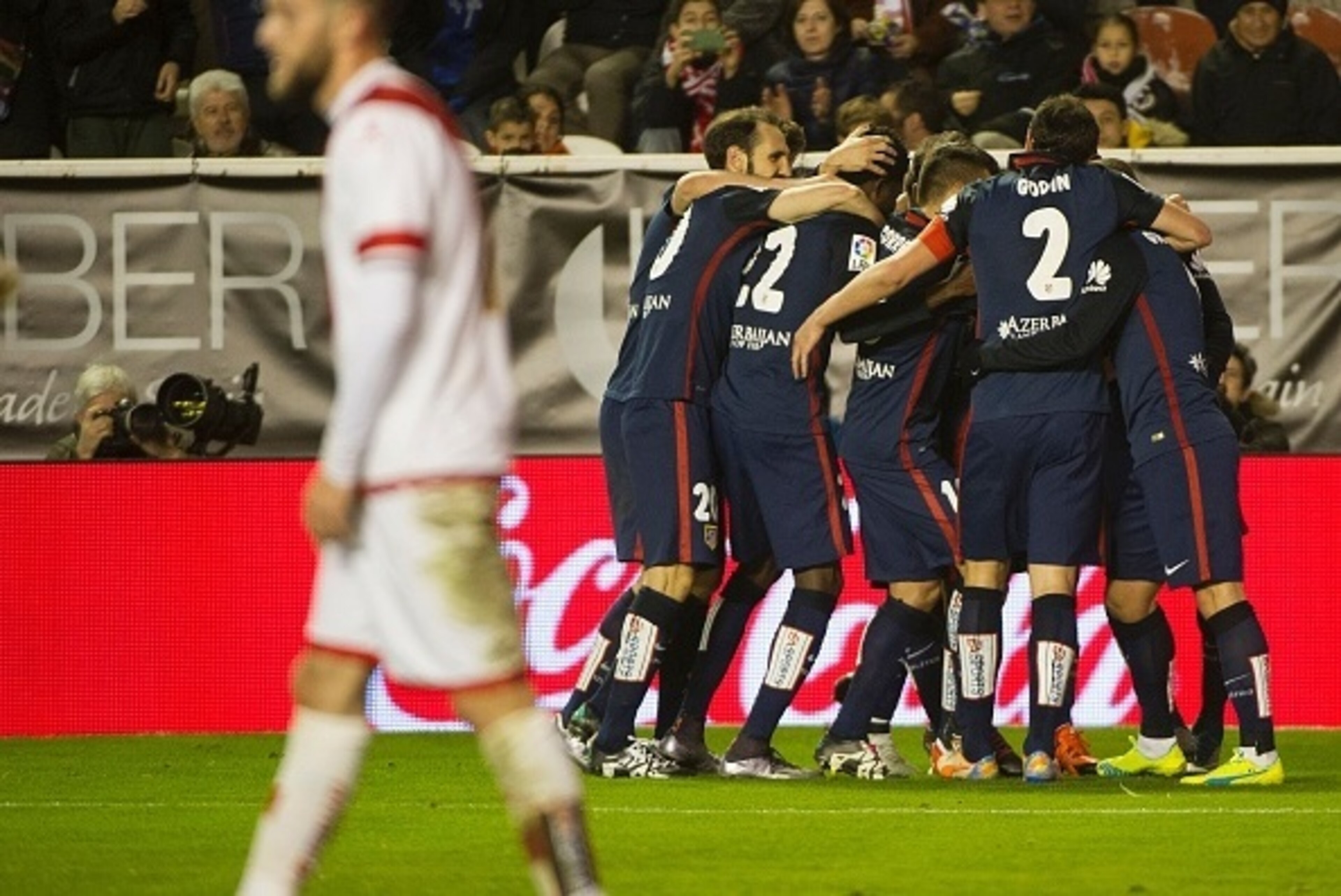 Atletico Madrid players celebrate after scoring their second goal during the Spanish league football match Rayo Vallecano de Madrid vs Club Atletico de Madrid at Vallecas stadium in Madrid on December 30, 2015.   AFP PHOTO/ CURTO DE LA TORRE / AFP / CURTO