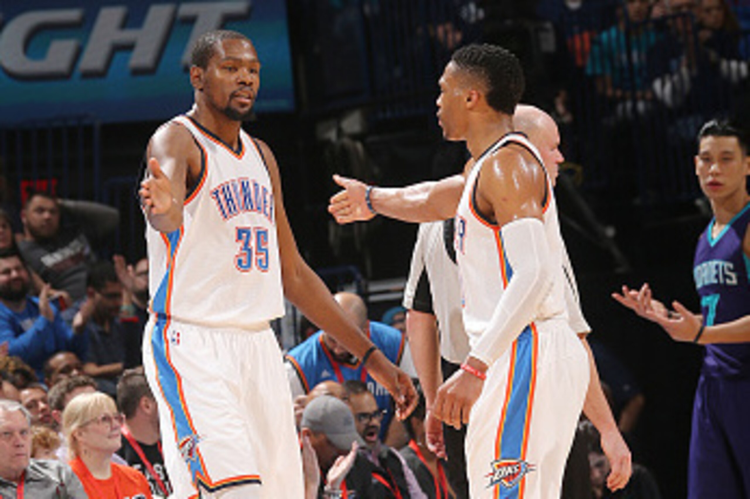 OKLAHOMA CITY, OK- JANUARY 20:  Kevin Durant #35 of the Oklahoma City Thunder shakes hands with Russell Westbrook #0 of the Oklahoma City Thunder during the game against the Charlotte Hornets on January 20, 2016 at Chesapeake Energy Arena in Oklahoma City