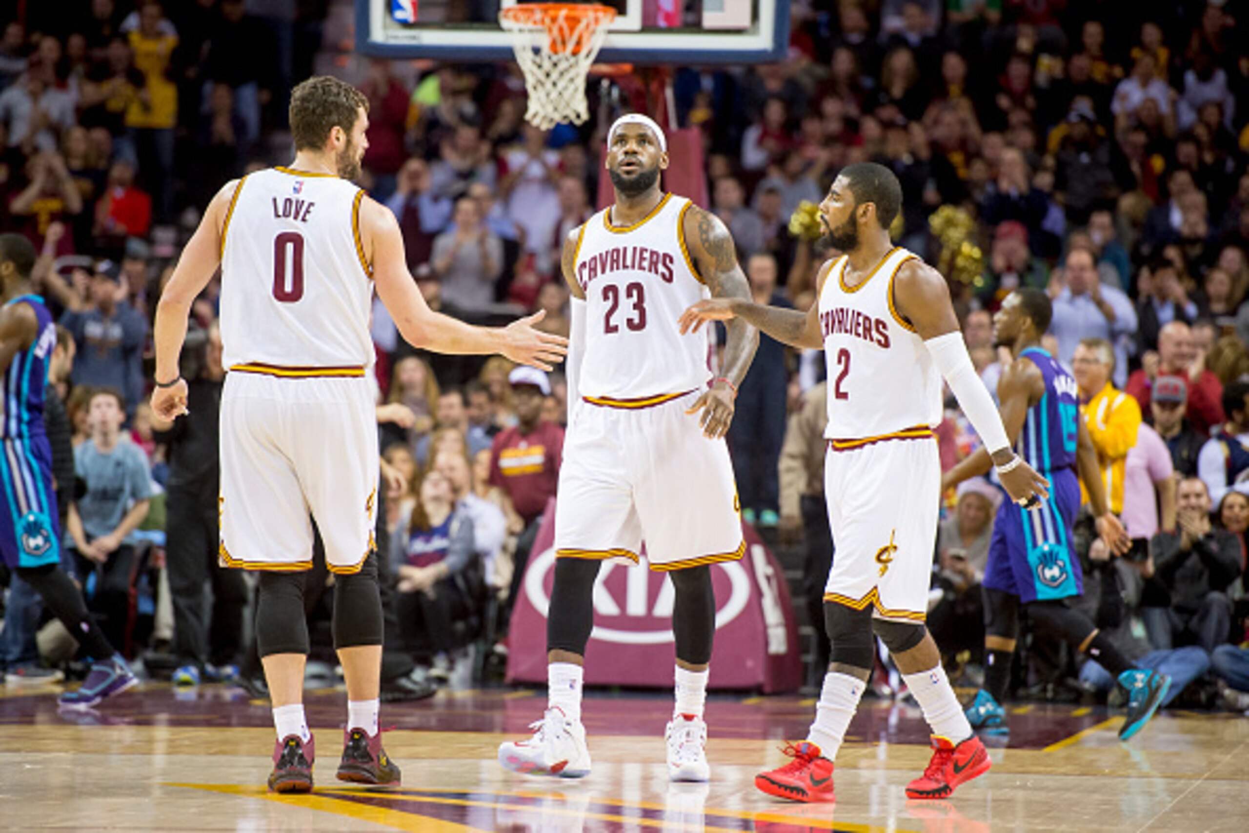 CLEVELAND, OH - DECEMBER 15: Kevin Love #0 LeBron James #23 and Kyrie Irving #2 of the Cleveland Cavaliers celebrate after a play during the first half against the Charlotte Hornets at Quicken Loans Arena on December 15, 2014 in Cleveland, Ohio. NOTE TO U CLEVELAND, OH - DECEMBER 15: Kevin Love #0 LeBron James #23 and Kyrie Irving #2 of the Cleveland Cavaliers celebrate after a play during the first half against the Charlotte Hornets at Quicken Loans Arena on December 15, 2014 in Cleveland, Ohio. NOTE TO U