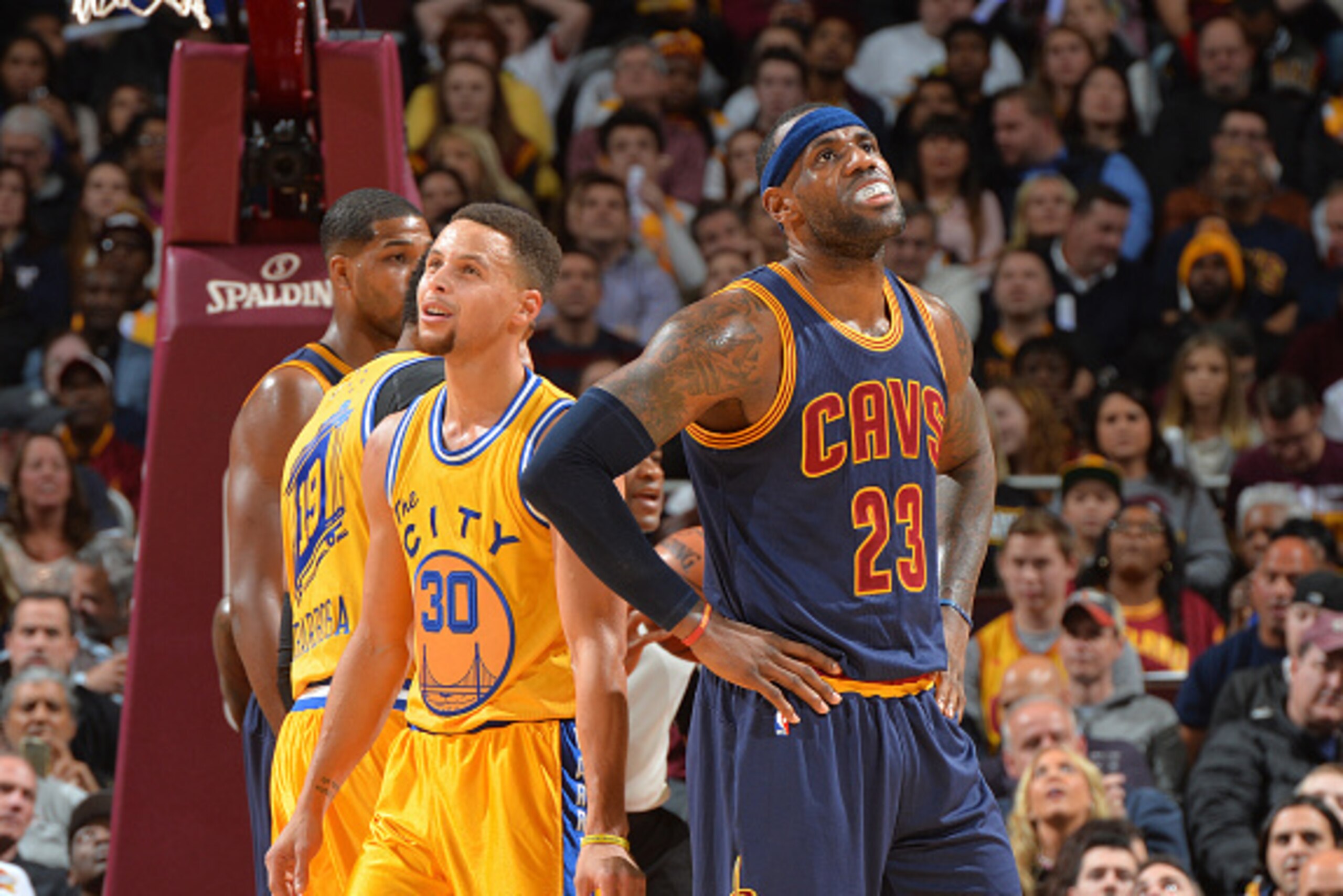 CLEVELAND, OH - JANUARY 18: LeBron James #23 of the Cleveland Cavaliers looks on against Stephen Curry #30 of the Golden State Warriors on January 18, 2016 at Quicken Loans Arena in Cleveland, Ohio. NOTE TO USER: User expressly acknowledges and agrees tha CLEVELAND, OH - JANUARY 18: LeBron James #23 of the Cleveland Cavaliers looks on against Stephen Curry #30 of the Golden State Warriors on January 18, 2016 at Quicken Loans Arena in Cleveland, Ohio. NOTE TO USER: User expressly acknowledges and agrees tha