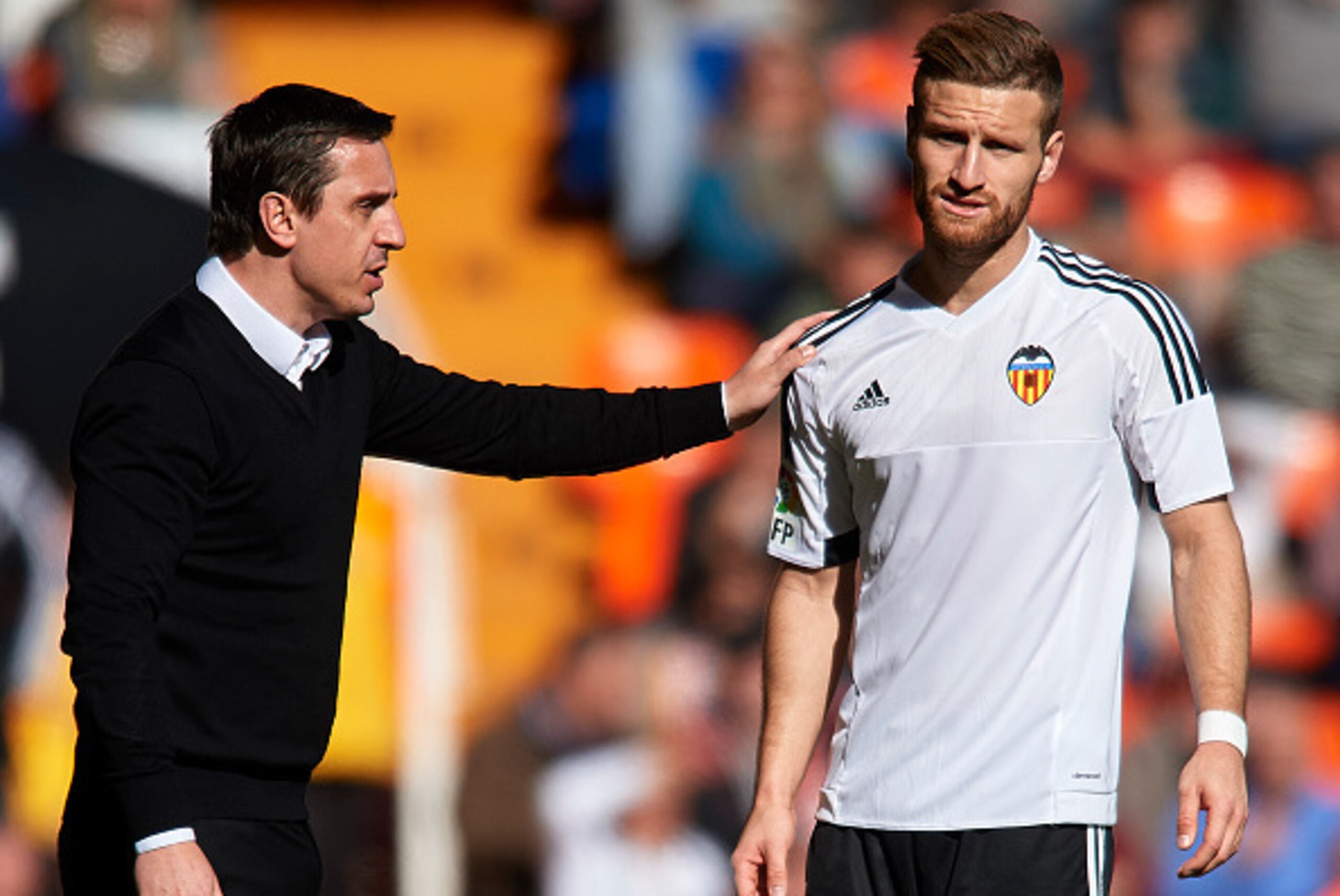 VALENCIA, SPAIN - JANUARY 17:  Gary Neville manager of Valencia CF gives instructions to his player Shkodran Mustafi during the La Liga match between Valencia CF and Rayo Vallecano at Estadi de Mestalla on January 17, 2016 in Valencia, Spain.  (Photo by M