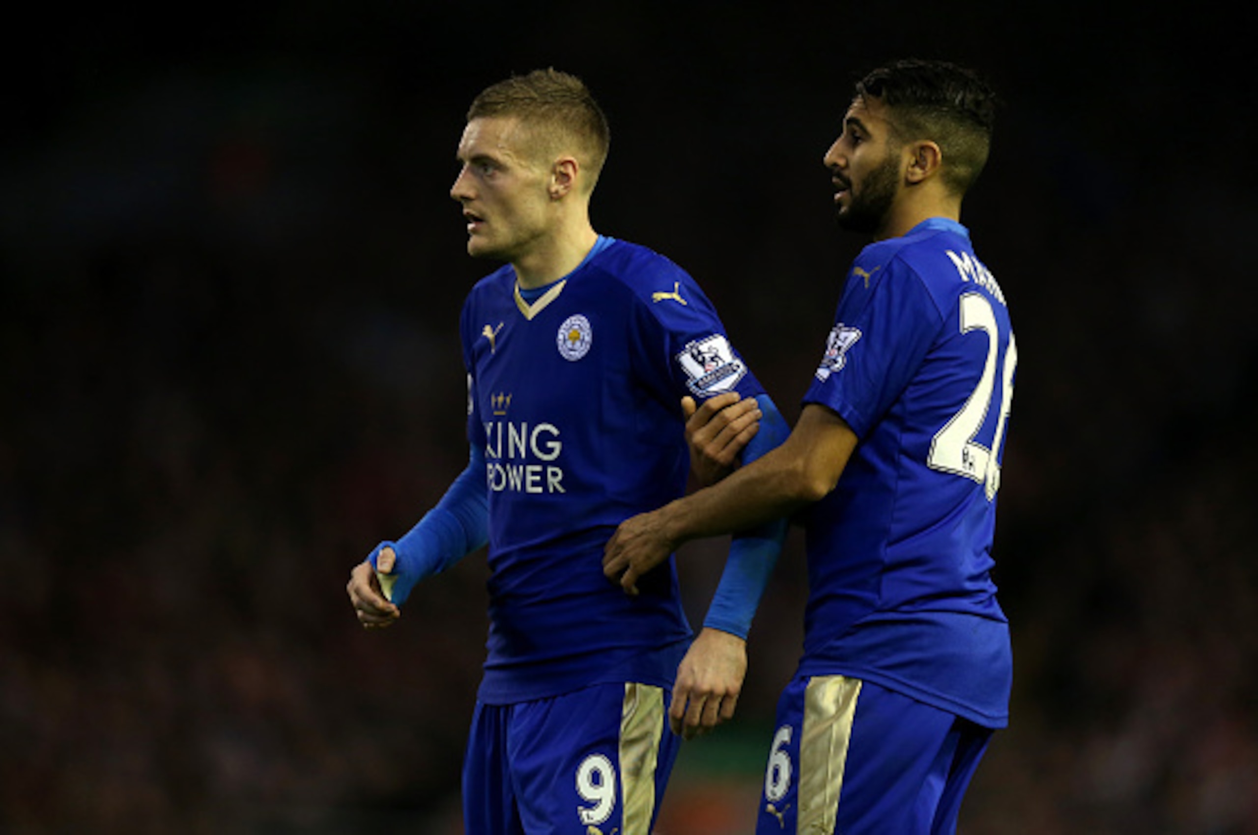 LIVERPOOL, ENGLAND - DECEMBER 26:  Riyad Mahrez of Leicester City (r) holds back Jamie Vardy of Leicester City during the Barclays Premier League match between Liverpool and Leicester City at Anfield on December 26, 2015 in Liverpool, England.  (Photo by 