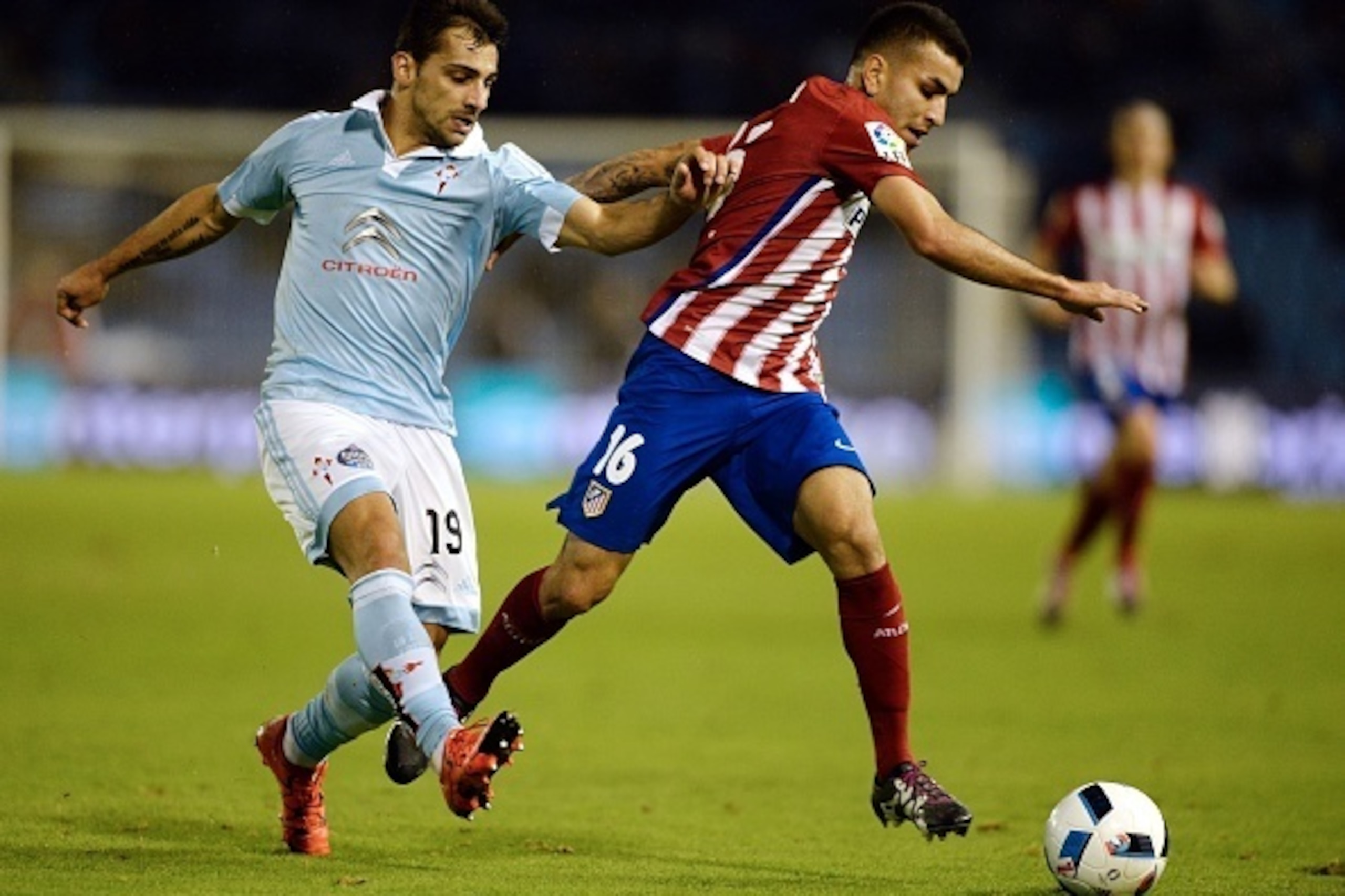 Atletico Madrid's Argentinian midfielder Angel Correa (R) vies with Celta Vigo's defender Jonny Castro during the Spanish Copa del Rey (King's Cup) football match Celta Vigo vs Club Atletico de Madrid at the Balaidos stadium in Vigo on January 20, 2016. Atletico Madrid's Argentinian midfielder Angel Correa (R) vies with Celta Vigo's defender Jonny Castro during the Spanish Copa del Rey (King's Cup) football match Celta Vigo vs Club Atletico de Madrid at the Balaidos stadium in Vigo on January 20, 2016.