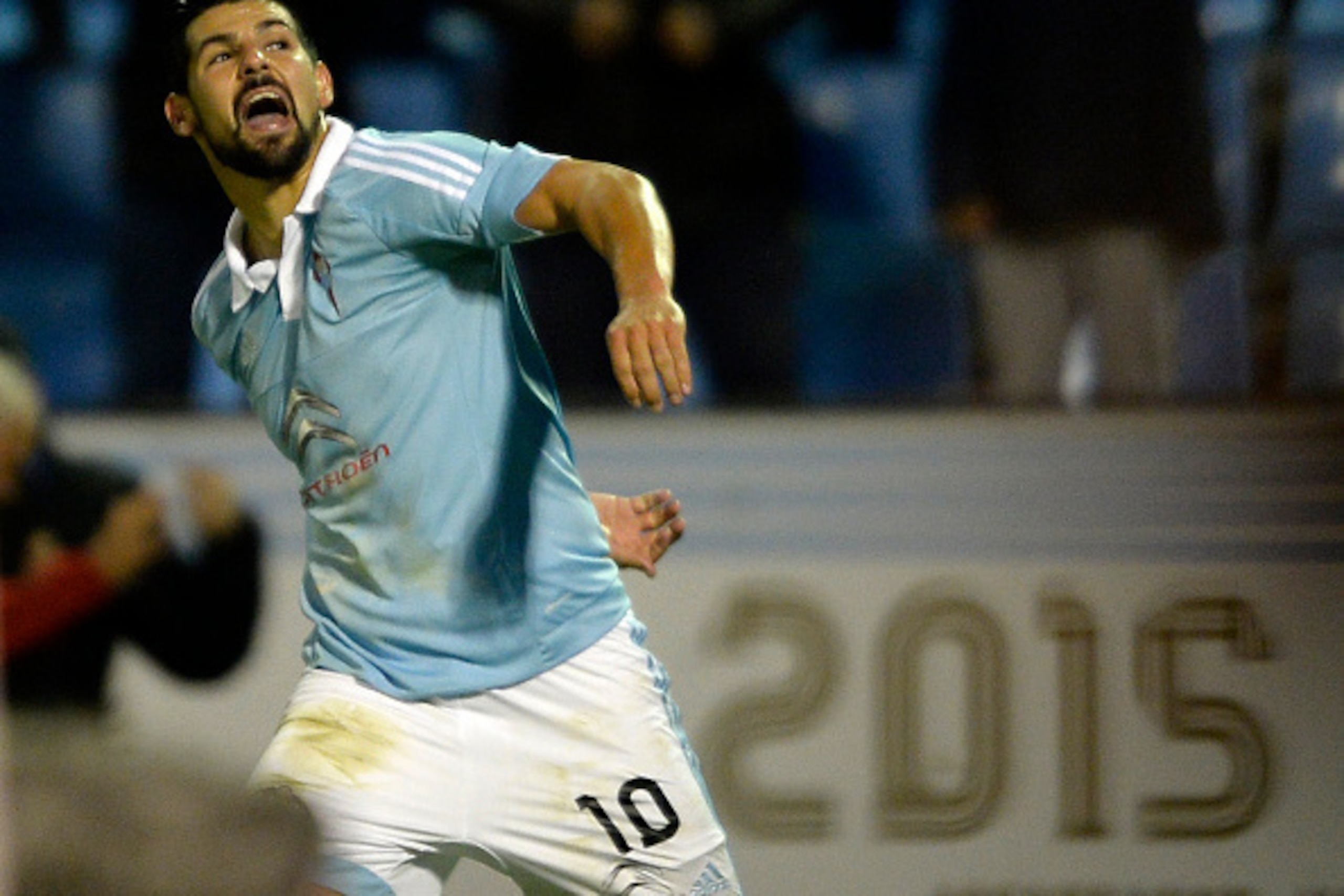 Celta Vigo's forward Nolito celebrates after scoring a goal during the Spanish league football match RC Celta de Vigo vs Real Sporting de Gijon at the Balaidos stadium in Vigo on November 28, 2015.   Celta won the match 2-1. AFP PHOTO/ MIGUEL RIOPA / AFP 