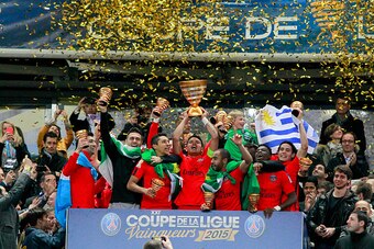 PARIS, FRANCE - APRIL 11: Thiago Silva #2, captain of Paris Saint-Germain FC lifts up the Coupe de la Ligue Trophy with Javier Pastore #27, Salvatore Sirigu #30, Marquinhos #5, Lucas #7, Serge Aurier #19, and Edinson Cavani #9 during the Trophy presentati