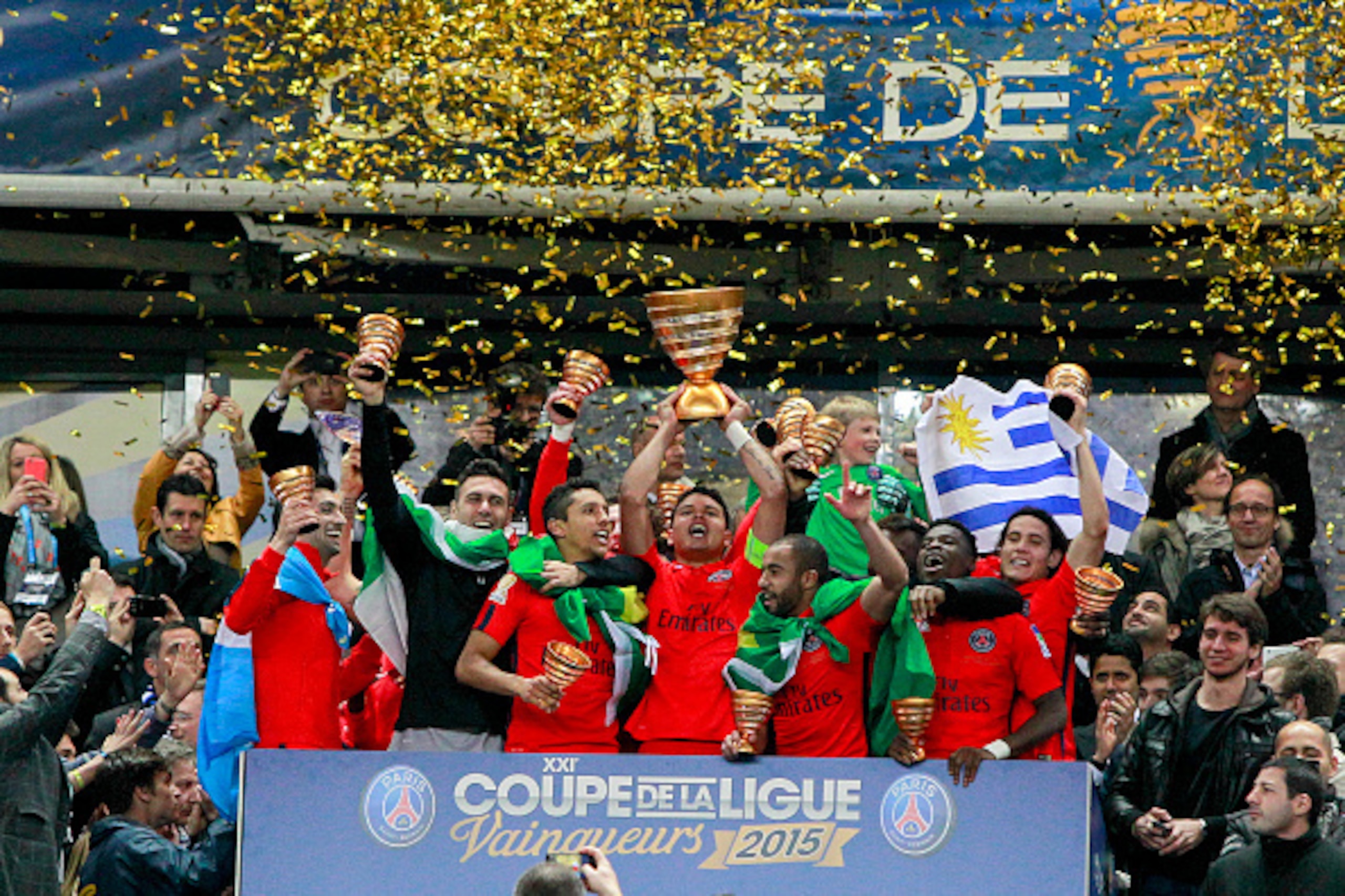 PARIS, FRANCE - APRIL 11: Thiago Silva #2, captain of Paris Saint-Germain FC lifts up the Coupe de la Ligue Trophy with Javier Pastore #27, Salvatore Sirigu #30, Marquinhos #5, Lucas #7, Serge Aurier #19, and Edinson Cavani #9 during the Trophy presentati
