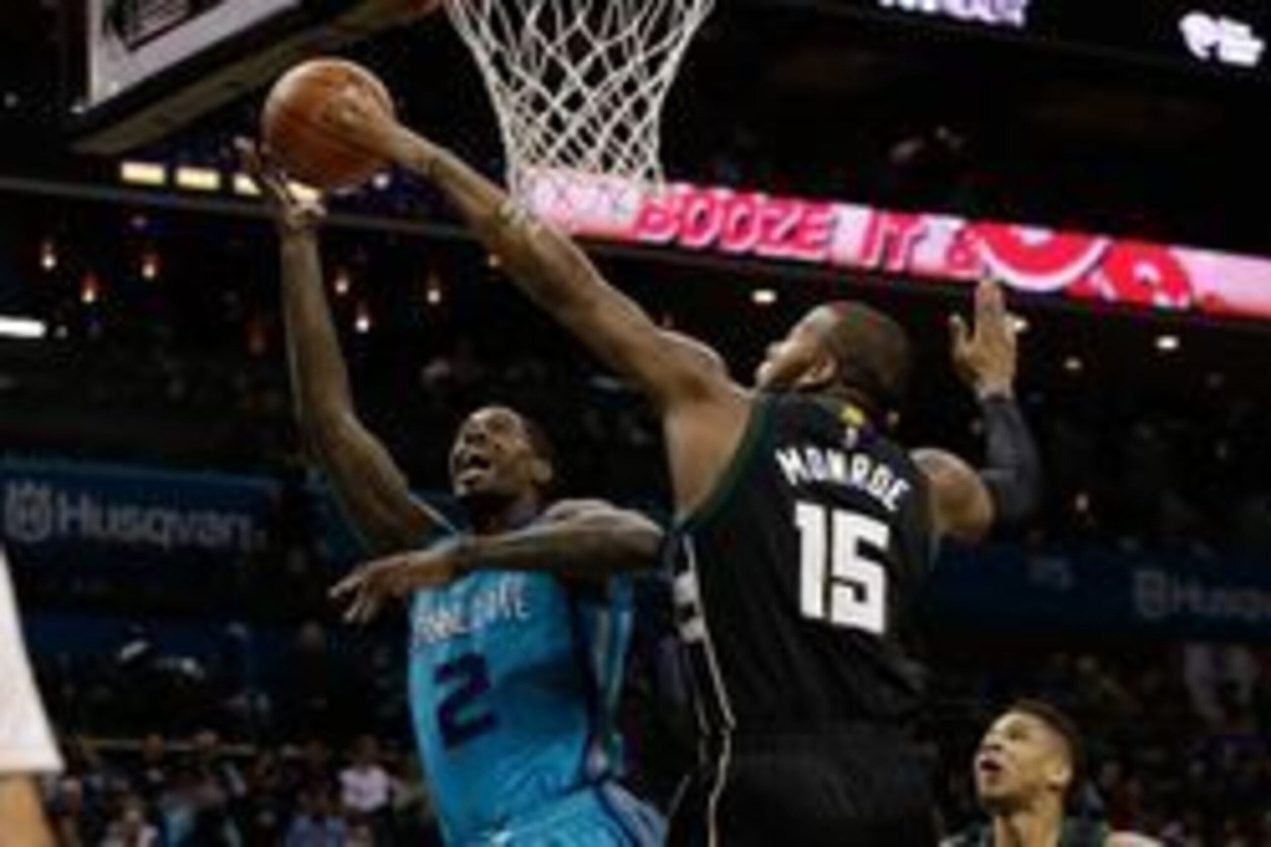 Jan 16, 2016; Charlotte, NC, USA; Charlotte Hornets forward Marvin Williams (2) has his shot blocked by Milwaukee Bucks center Greg Monroe (15) during the second half at Time Warner Cable Arena. The Bucks defeated the Hornets 105-92. Mandatory Credit: Jer