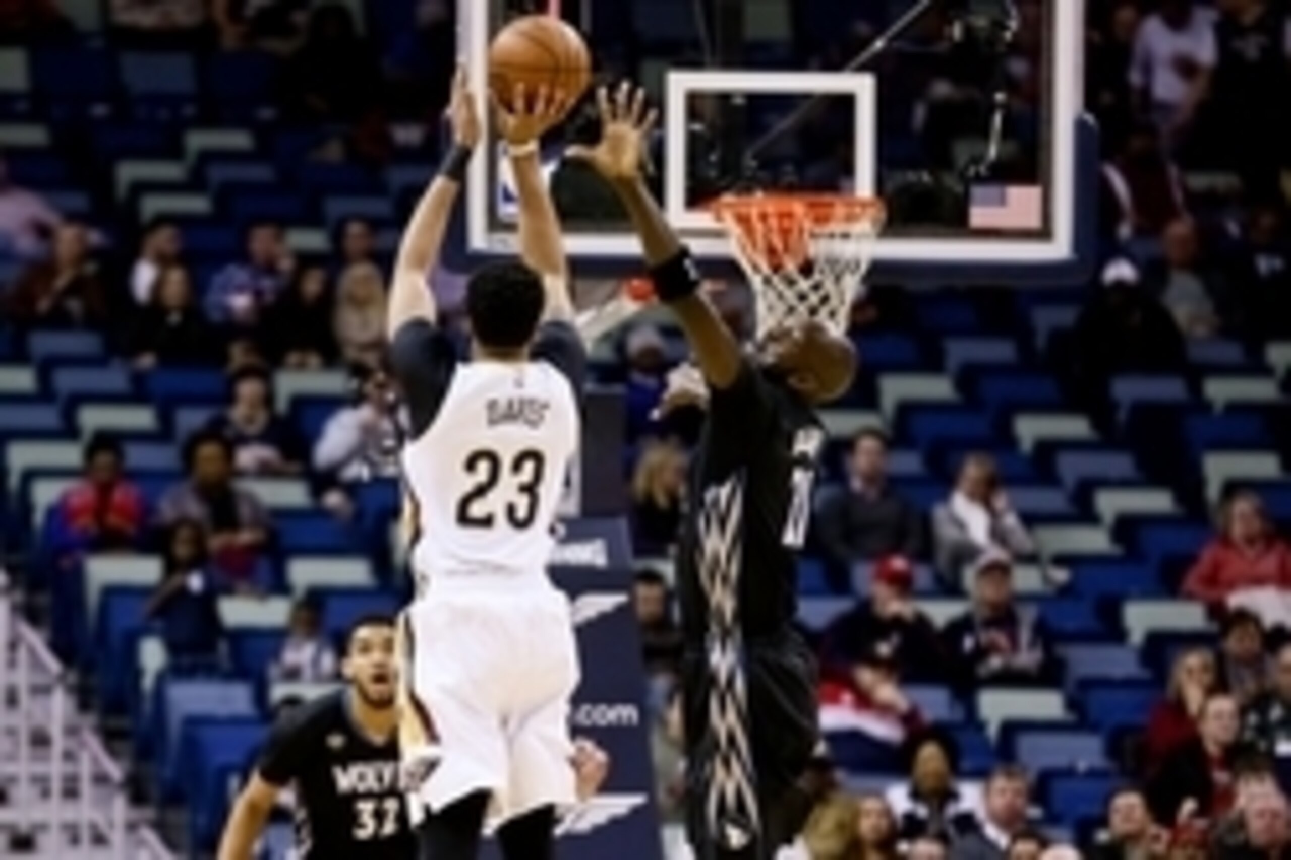 Jan 19, 2016; New Orleans, LA, USA; New Orleans Pelicans forward Anthony Davis (23) shoots over Minnesota Timberwolves forward Kevin Garnett (21) during the first quarter of a game at the Smoothie King Center. Mandatory Credit: Derick E. Hingle-USA TODAY 