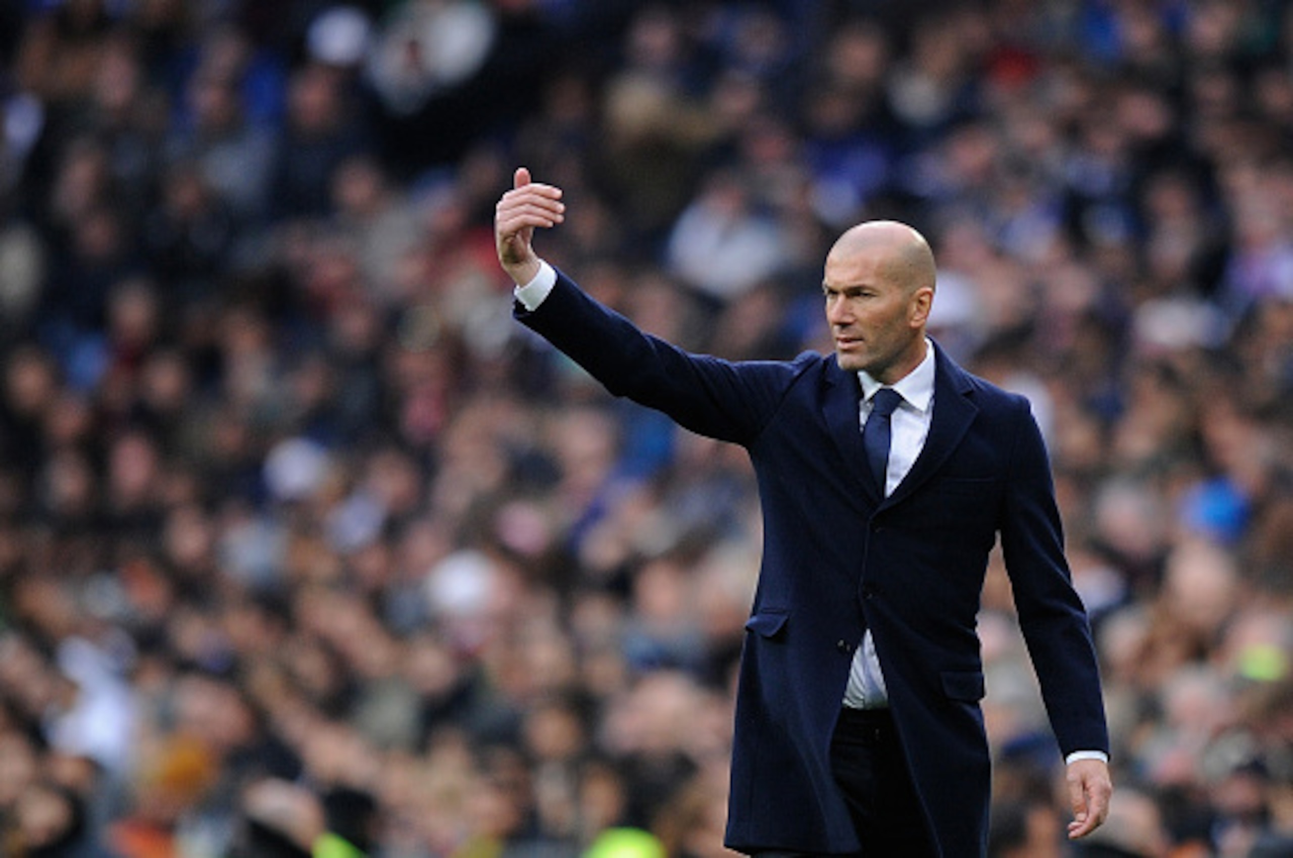 MADRID, SPAIN - JANUARY 17:  Zinedine Zidane manager of Real Madrid reacts during the La Liga match between Real Madrid CF and Sporting Gijon at Estadio Santiago Bernabeu on January 17, 2016 in Madrid, Spain.  (Photo by Denis Doyle/Getty Images)