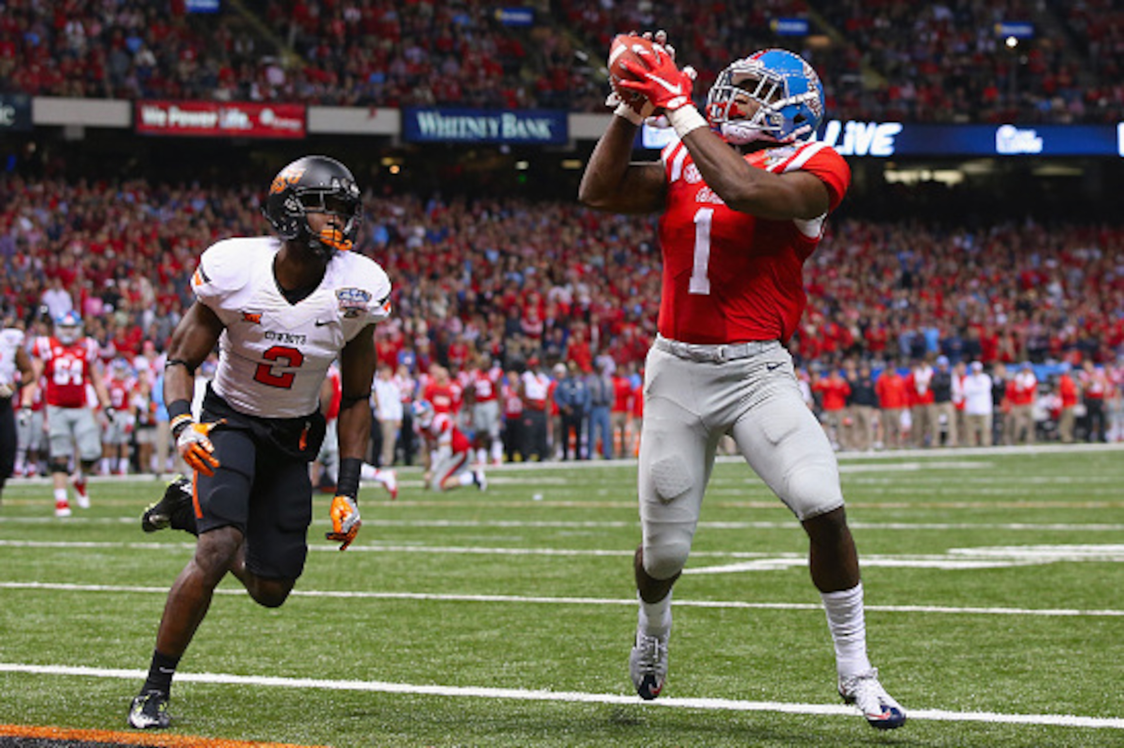 NEW ORLEANS, LA - JANUARY 01:  Laquon Treadwell #1 of the Mississippi Rebels scores a touchdown against the Oklahoma State Cowboys during the fourth quarter of the Allstate Sugar Bowl at Mercedes-Benz Superdome on January 1, 2016 in New Orleans, Louisiana