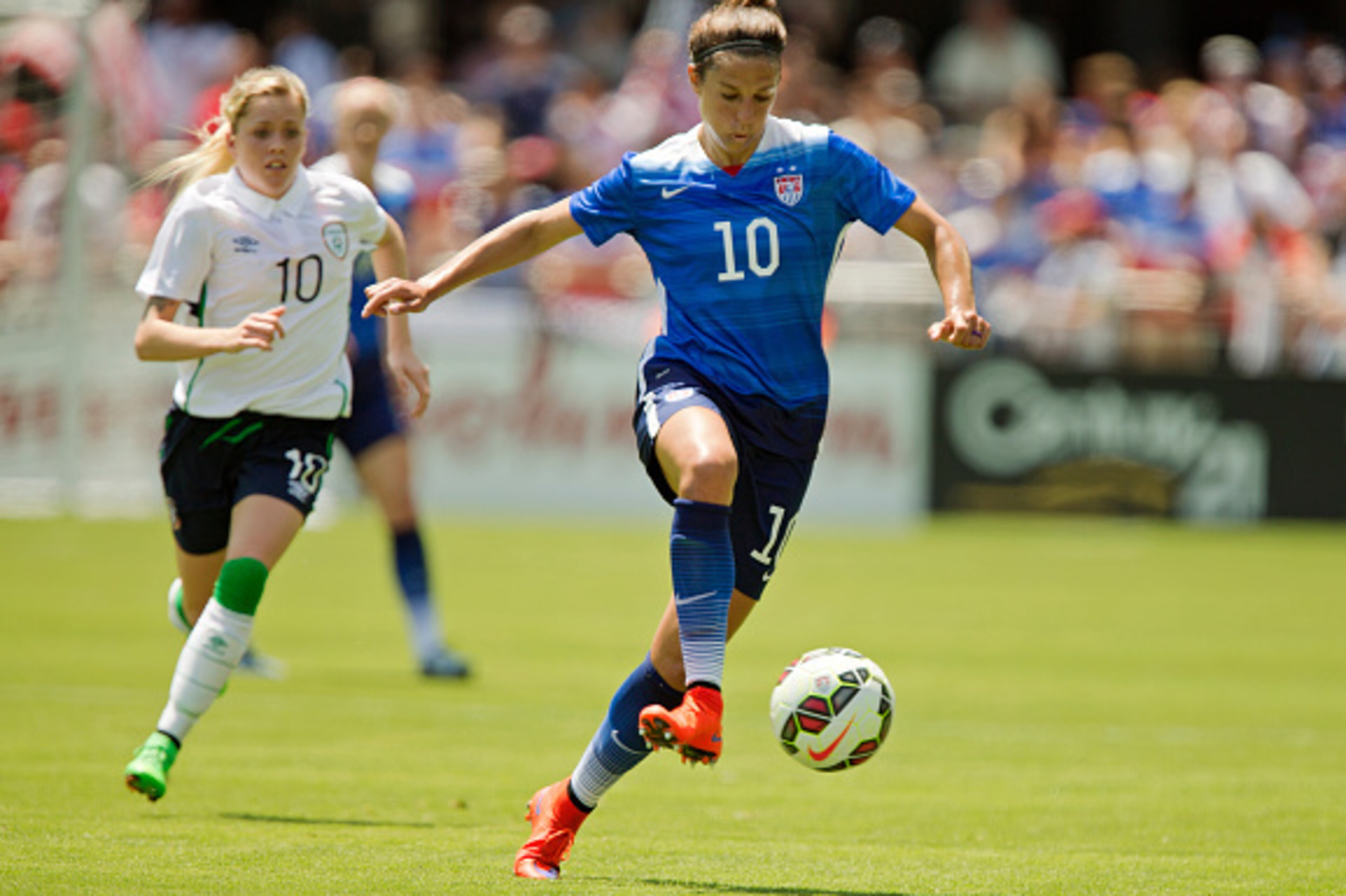 SAN JOSE, CA - MAY 10:  Carli Lloyd #10 of the United States takes off with the ball against Denise O'Sullivan #10 of Ireland in the first half of their international friendly match on May 10, 2015 at Avaya Stadium in San Jose, California.  The U.S. won 3
