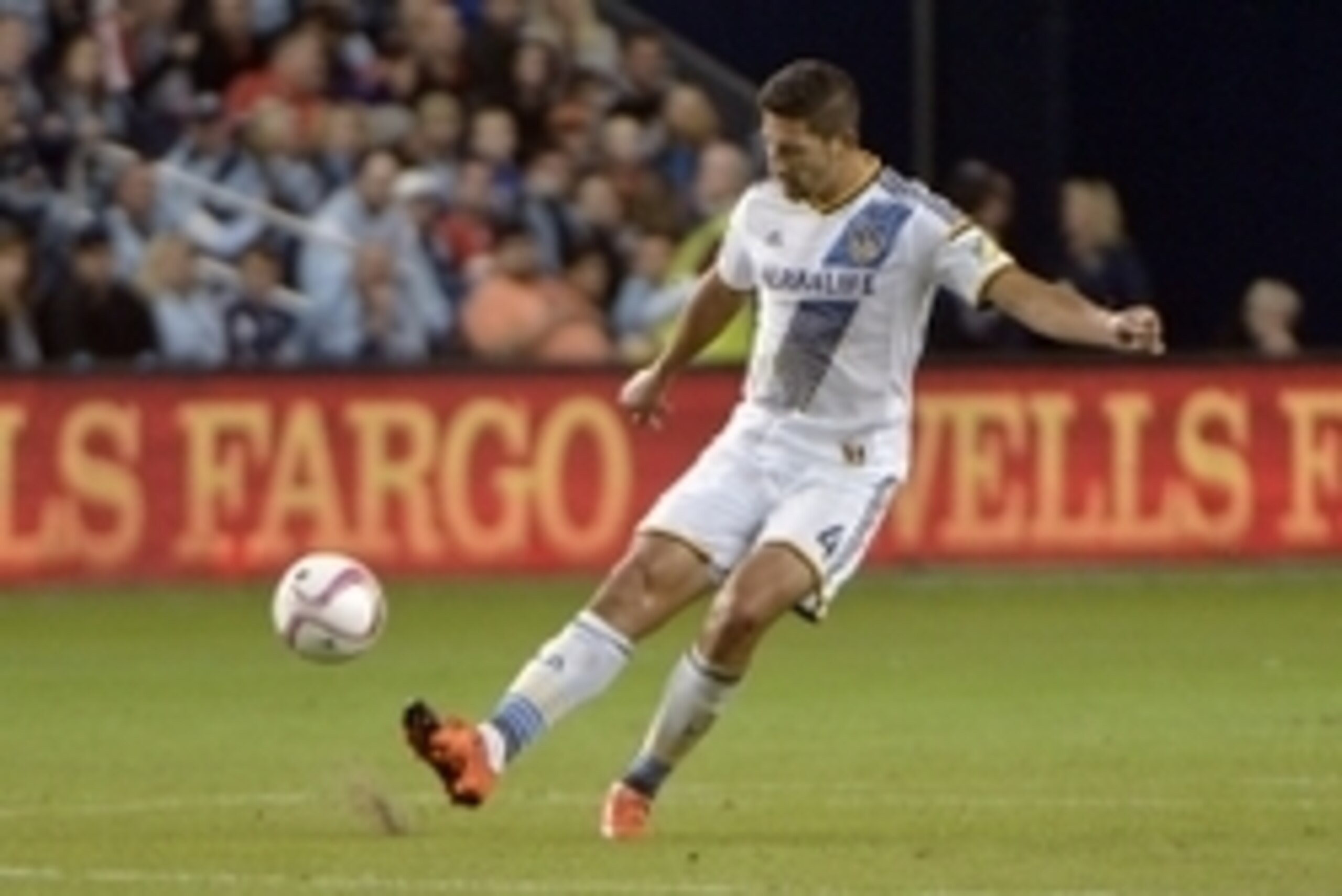 Oct 25, 2015; Kansas City, KS, USA; Los Angeles Galaxy defender Omar Gonzalez (4) passes the ball during the second half of the match against Sporting KC at Sporting Park. Sporting KC won the match 2-1. Mandatory Credit: Denny Medley-USA TODAY Sports