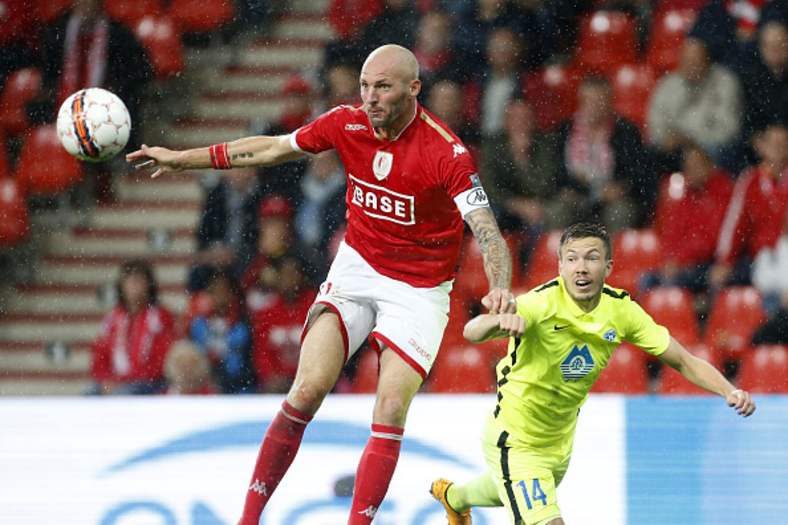 LIEGE, FRANCE - AUGUST 27: Jelle Van Damme of Standard de Liege and Martin Linnes of Molde FK in action during the UEFA Europa League play off round 2nd leg between Standard Liege and Molde FK at Stade Maurice Dufrasne, aka Stade de Sclessin on August 27,