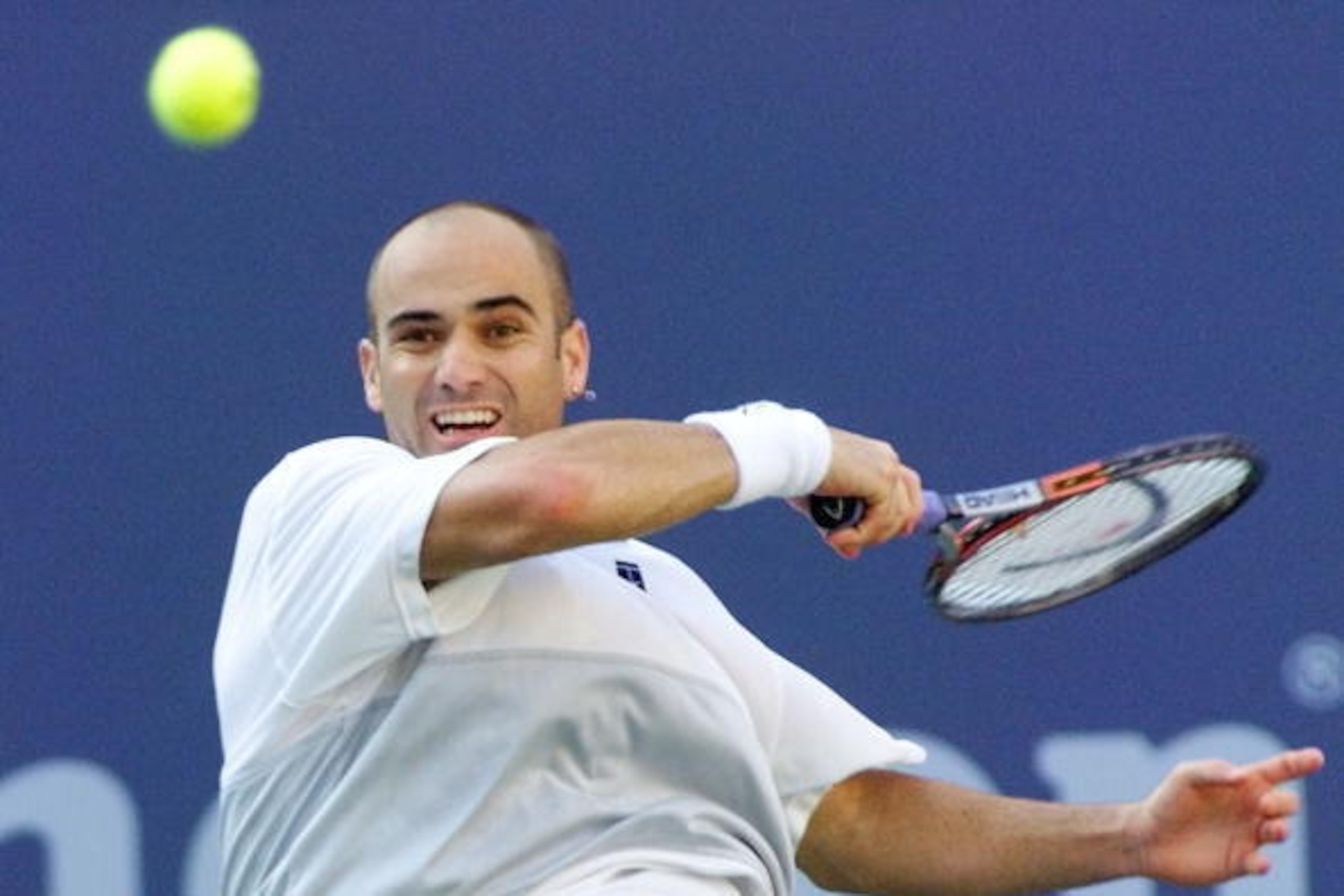 FLUSHING MEADOWS, UNITED STATES:  Number two seeded Andre Agassi of the US hits a forehand return to number seven seeded Todd Martin of the US 12 September, 1999, at the US Open Men's Finals in Flushing Meadows, NY.   (ELECTRONIC IMAGE)    AFP PHOTO/Rober