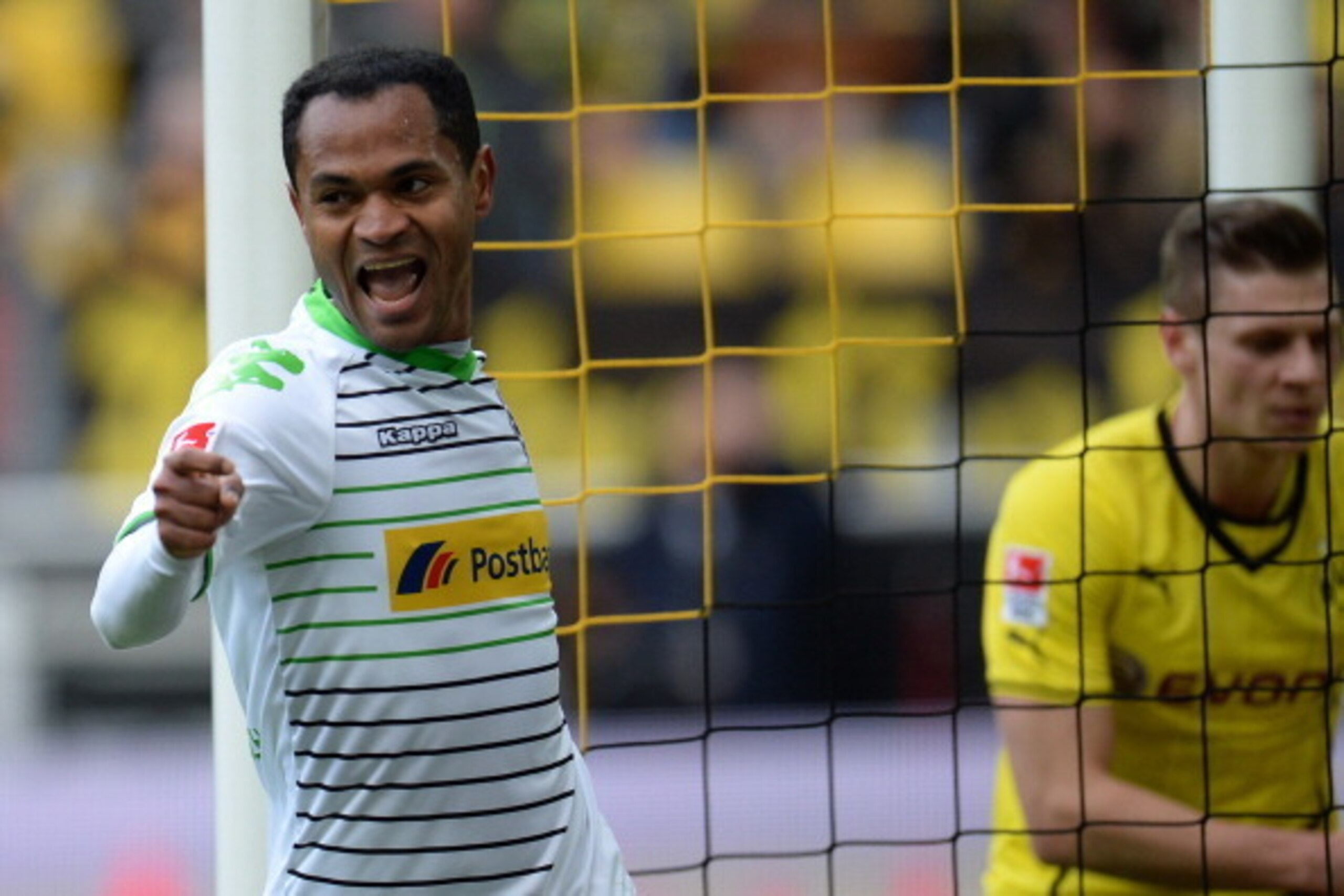 Moenchengladbach's Brazilian midfielder Raffael celebrates during the German first division Bundesliga football match Borussia Dortmund vs Borussia Moenchengladbach in the German city of Dortmund on March 15, 2014. AFP PHOTO / PATRIK STOLLARZ

DFL RULES T