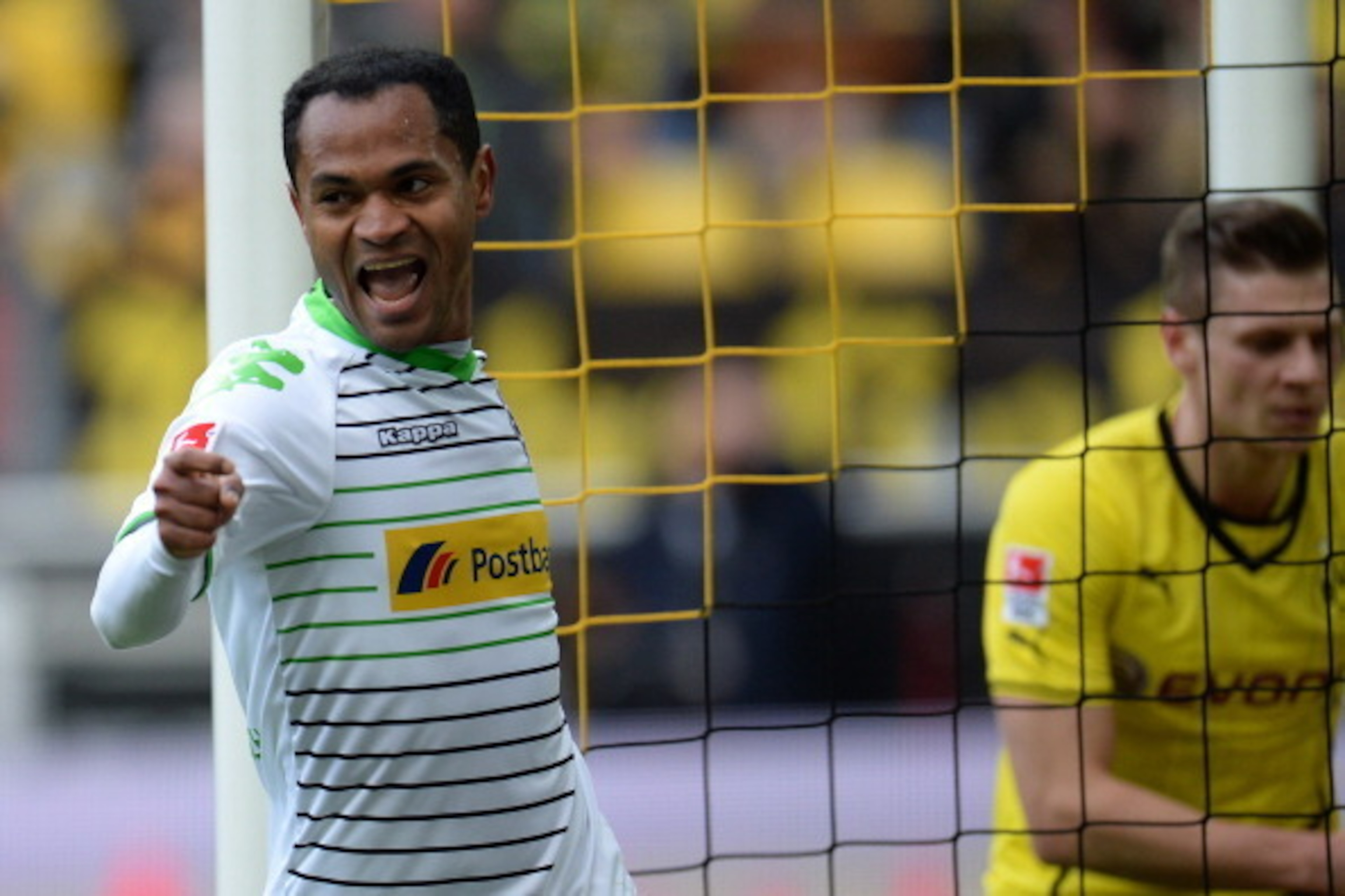 Moenchengladbach's Brazilian midfielder Raffael celebrates during the German first division Bundesliga football match Borussia Dortmund vs Borussia Moenchengladbach in the German city of Dortmund on March 15, 2014. AFP PHOTO / PATRIK STOLLARZ

DFL RULES T