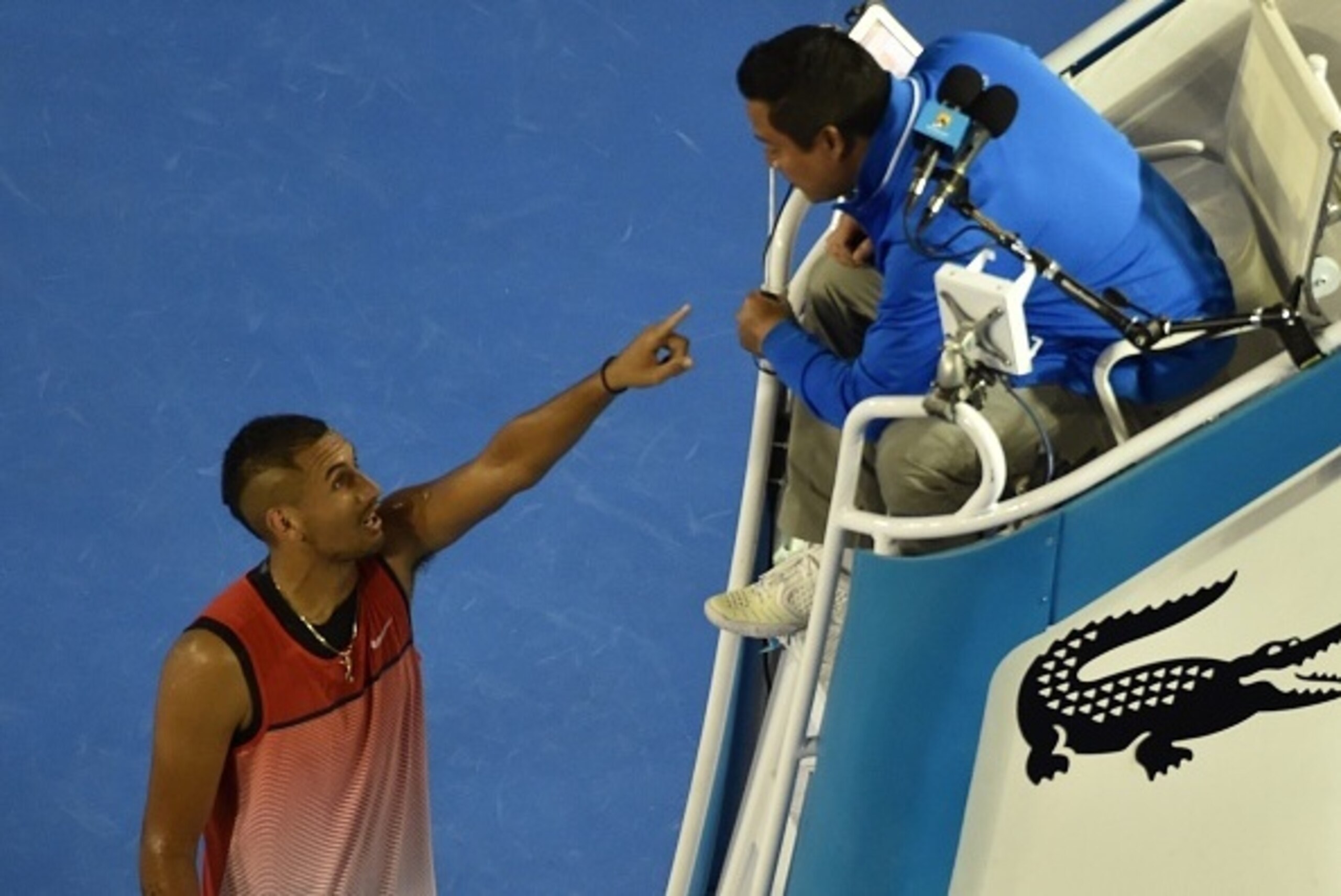 Australia's Nick Kyrgios (L) gestures as he speaks with the umpire (R) as he plays against Czech Republic's Tomas Berdych during their men's singles match on day five of the 2016 Australian Open tennis tournament in Melbourne on January 22, 2016. AFP PHOT Australia's Nick Kyrgios (L) gestures as he speaks with the umpire (R) as he plays against Czech Republic's Tomas Berdych during their men's singles match on day five of the 2016 Australian Open tennis tournament in Melbourne on January 22, 2016. AFP PHOT