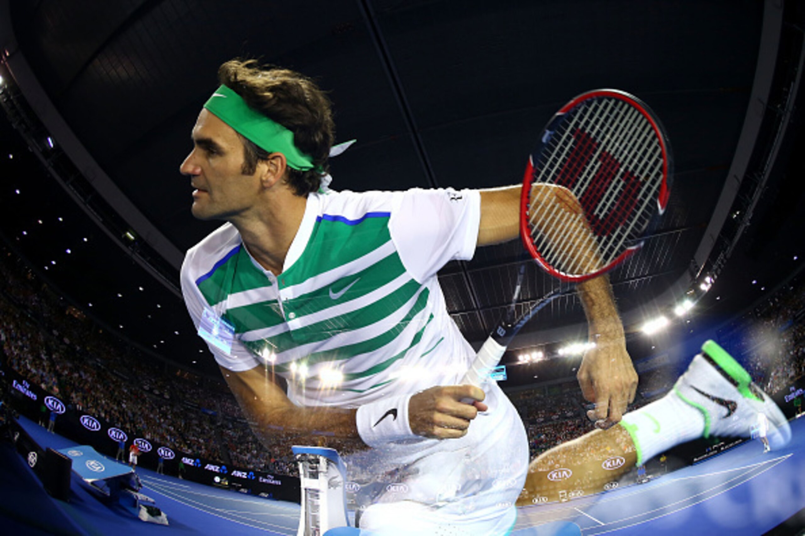 MELBOURNE, AUSTRALIA - JANUARY 22:  (EDITORS NOTE: Multiple exposures were combined in camera to produce this image.) Roger Federer of Switzerland serves in his third round match against Grigor Dimitrov of Bulgaria during day five of the 2016 Australian O