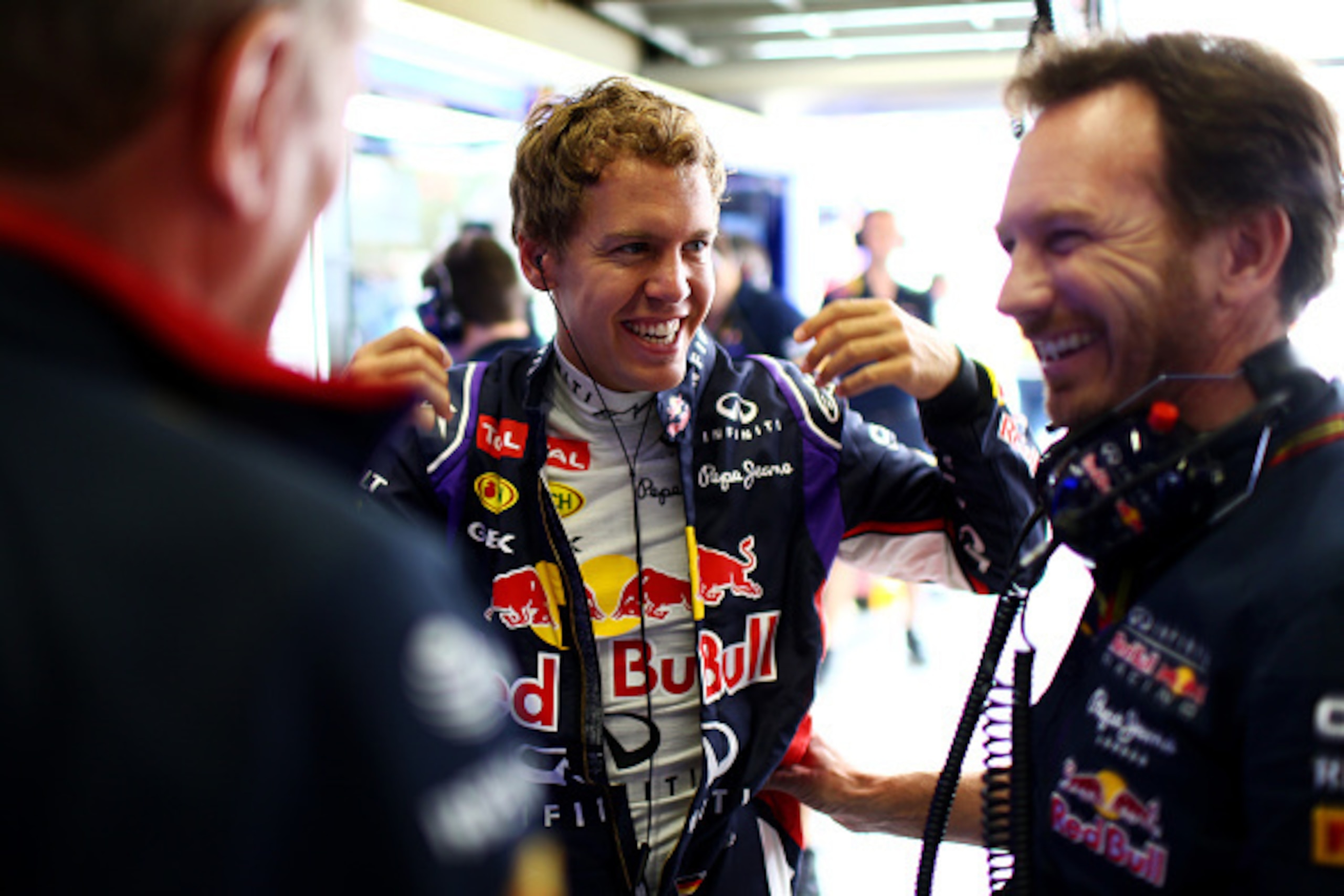 SAO PAULO, BRAZIL - NOVEMBER 08:  Sebastian Vettel of Germany and Infiniti Red Bull Racing laughs with Infiniti Red Bull Racing Team Principal Christian Horner and team consultant Dr Helmut Marko during final practice for the Brazilian Formula One Grand P