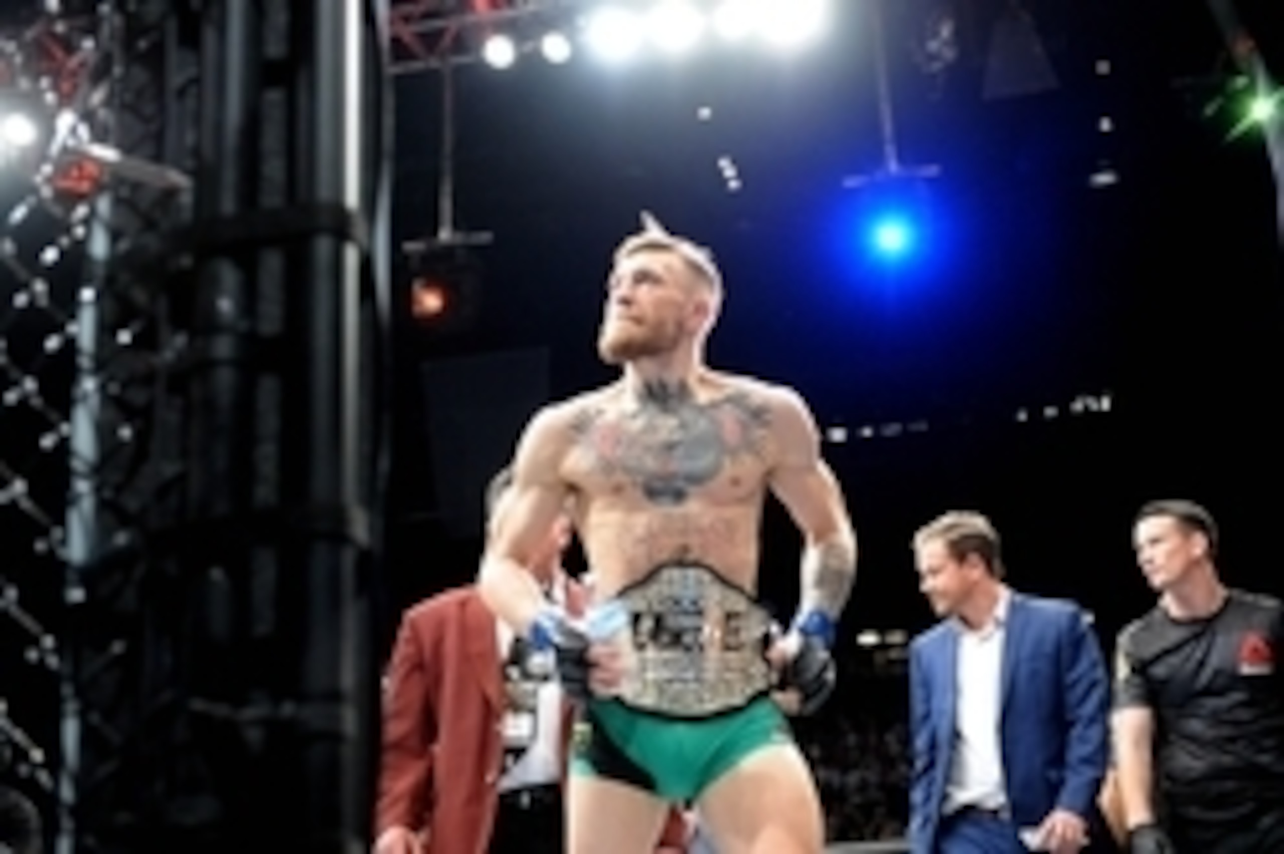 December 12, 2015; Las Vegas, NV, USA; Conor McGregor exits the octogon following his championship victory against Jose Aldo during UFC 194 at MGM Grand Garden Arena. Mandatory Credit: Gary A. Vasquez-USA TODAY Sports