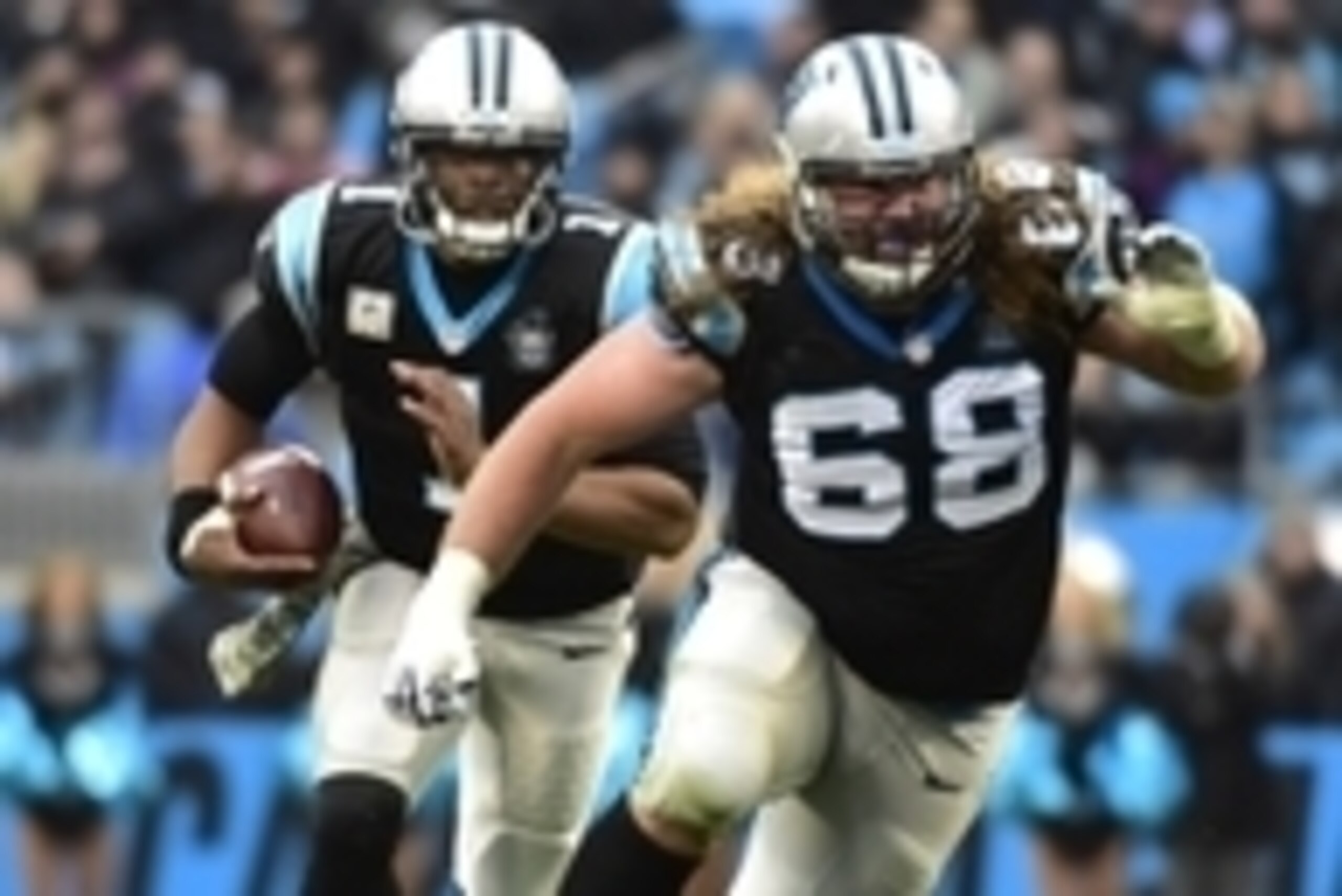 Nov 16, 2014; Charlotte, NC, USA; Carolina Panthers quarterback Cam Newton (1) runs as guard Andrew Norwell (68) blocks in the fourth quarter. The Falcons defeated the Panthers 19-17 at Bank of America Stadium. Mandatory Credit: Bob Donnan-USA TODAY Sport