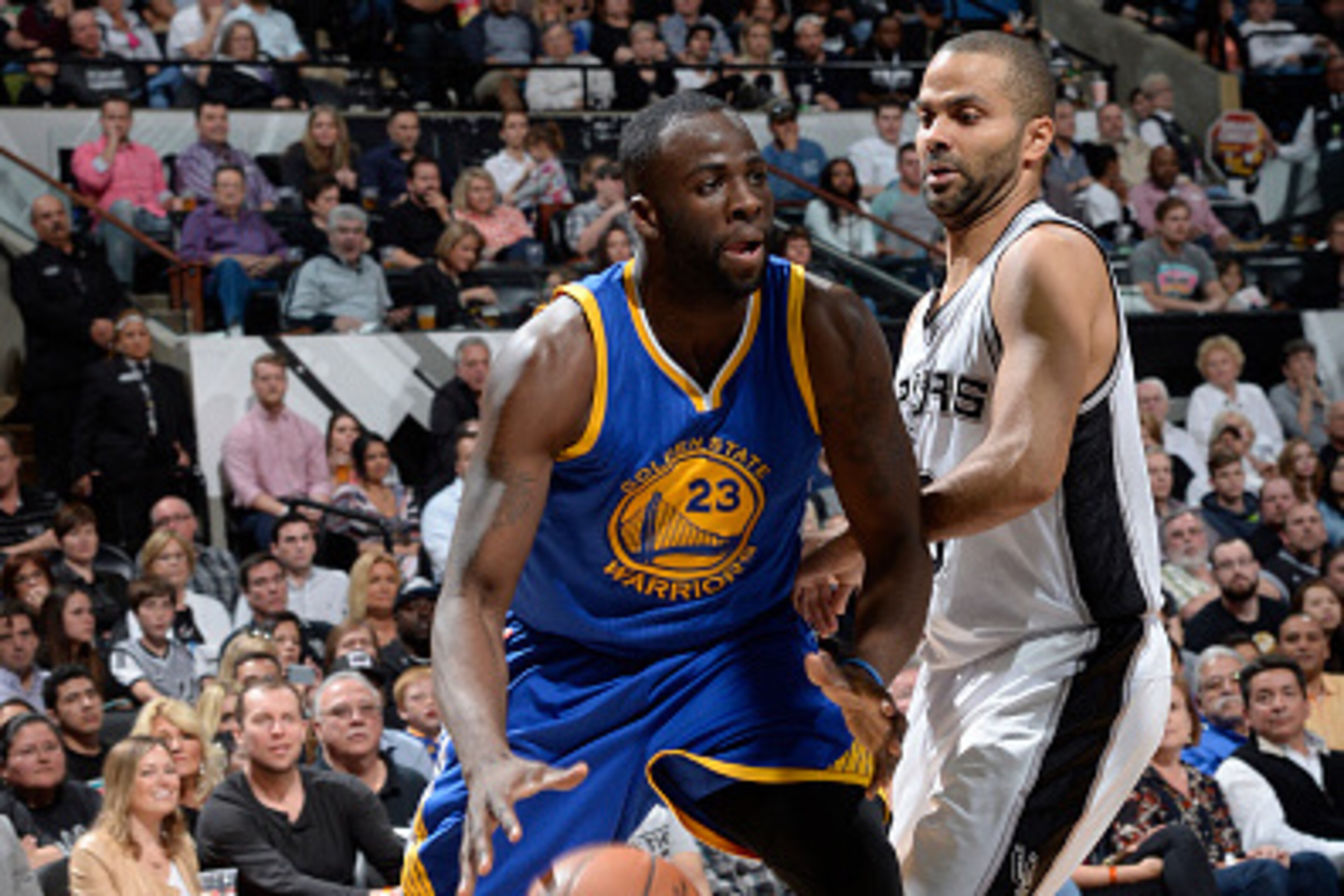 SAN ANTONIO, TX - APRIL 5: Draymond Green #23 of the Golden State Warriors handles the ball against Tony Parker #9 of the San Antonio Spurs on April 5, 2015 at the AT&T Center in San Antonio, Texas. NOTE TO USER: User expressly acknowledges and agrees tha