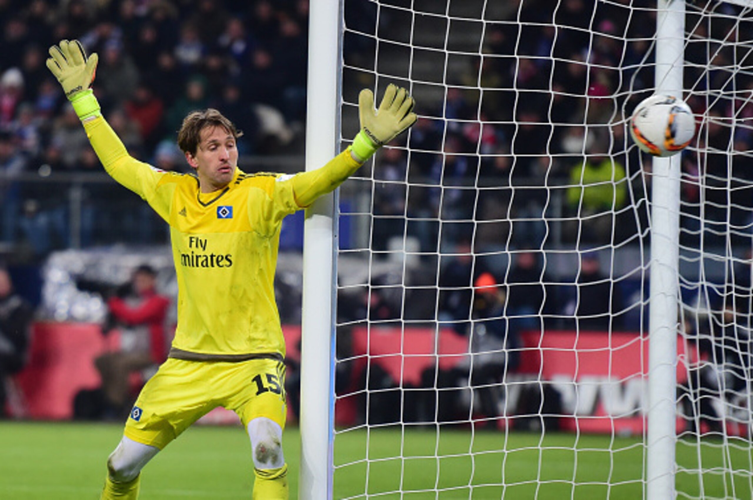 Hamburg's goalkeeper Rene Adler fails to catch the ball during the Bundesliga match Hamburg HSV vs Bayern Munich in Hamburg, north Germany on January 22, 2016. / AFP / John MACDOUGALL / RESTRICTIONS: DURING MATCH TIME: DFL RULES TO LIMIT THE ONLINE USAGE 