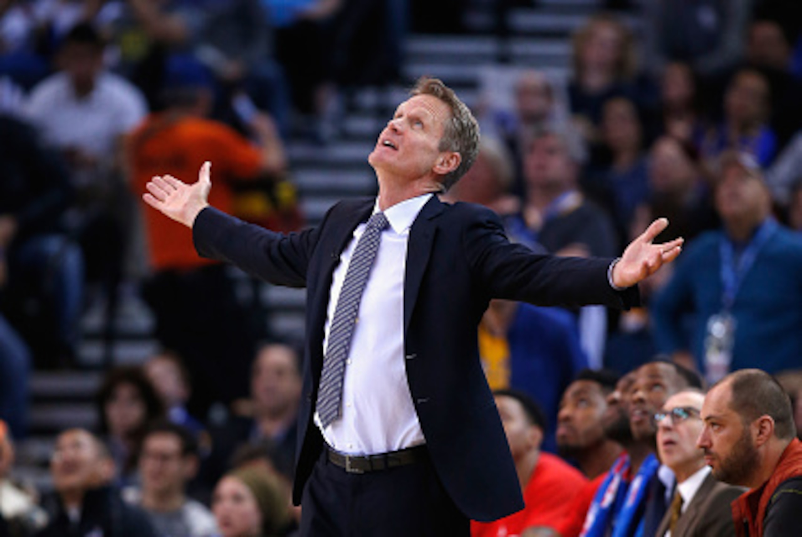 OAKLAND, CA - JANUARY 22:  Head coach Steve Kerr of the Golden State Warriors questions a call while watching the replay during their game against the Indiana Pacers at ORACLE Arena on January 22, 2016 in Oakland, California.  This is Kerr's first game of