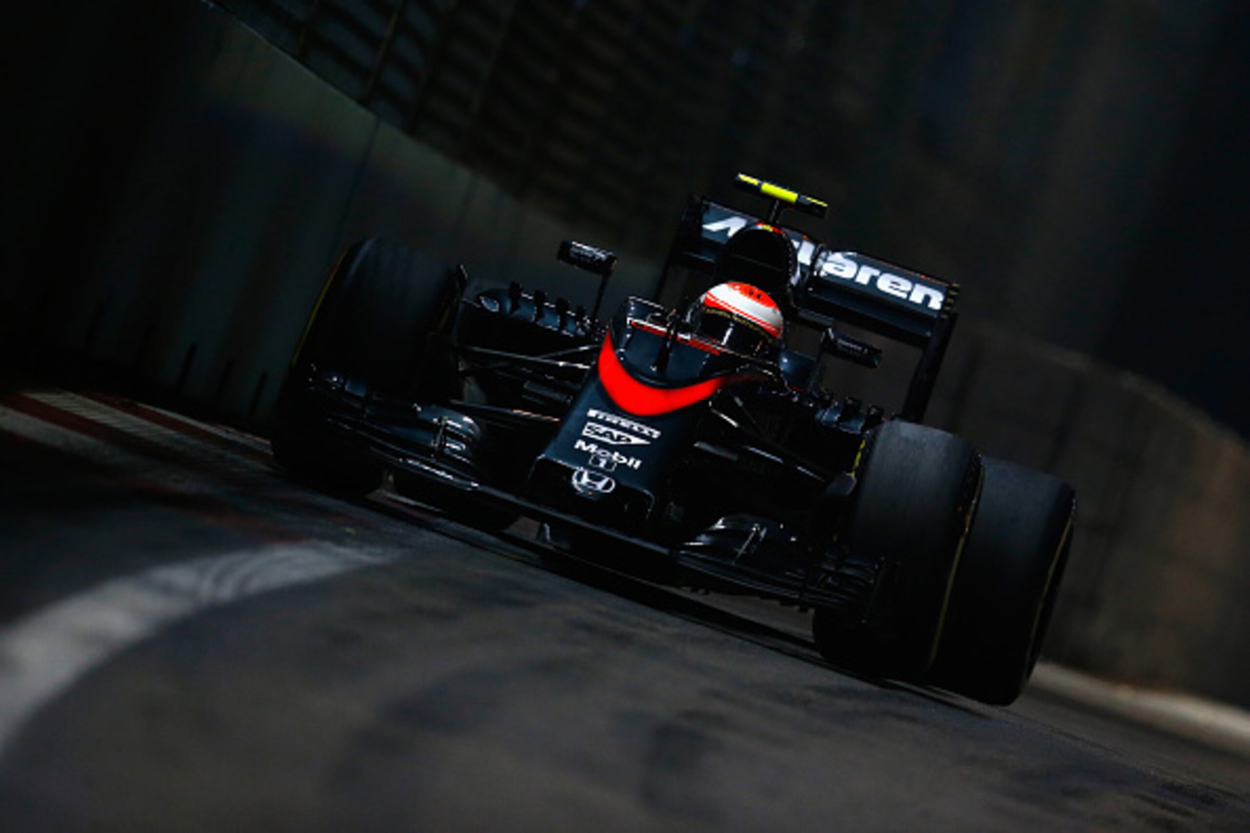 SINGAPORE - SEPTEMBER 18:  Jenson Button of Great Britain and McLaren Honda drives during practice for the Formula One Grand Prix of Singapore at Marina Bay Street Circuit on September 18, 2015 in Singapore.  (Photo by Clive Rose/Getty Images)