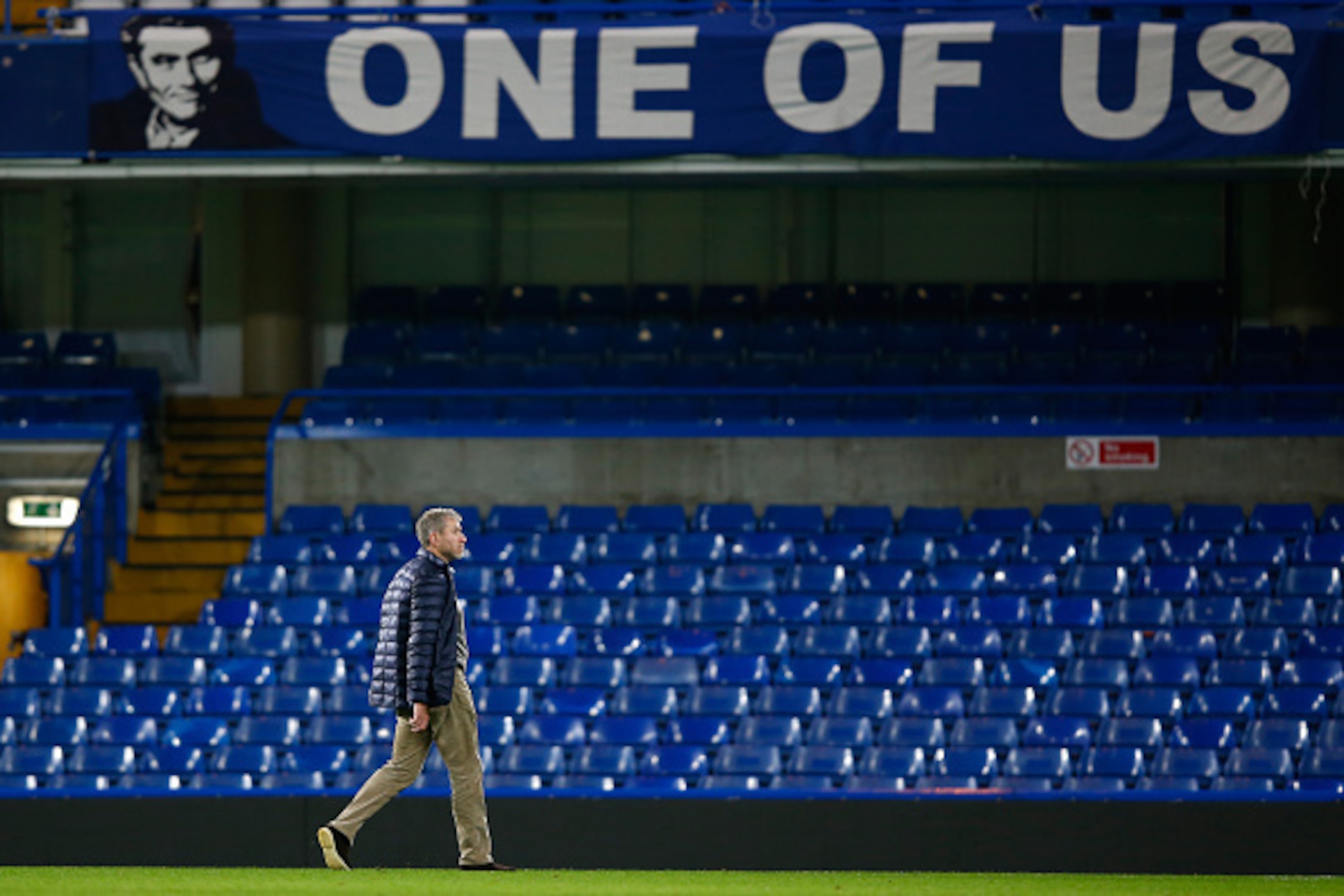 LONDON, ENGLAND - DECEMBER 19:  Chelsea owner Roman Abramovich walks past a banner to support Jose Mourinho after their 3-1 win in the Barclays Premier League match between Chelsea and Sunderland at Stamford Bridge on December 19, 2015 in London, England.