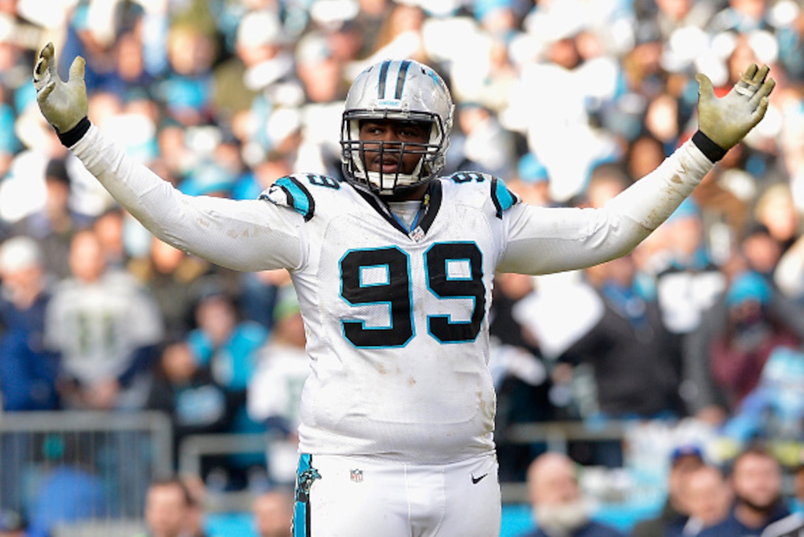CHARLOTTE, NC - JANUARY 17:  Kawann Short #99 of the Carolina Panthers reacts after defeating the Seattle Seahawks 31-24 at the NFC Divisional Playoff Game at Bank of America Stadium on January 17, 2016 in Charlotte, North Carolina.  (Photo by Grant Halve