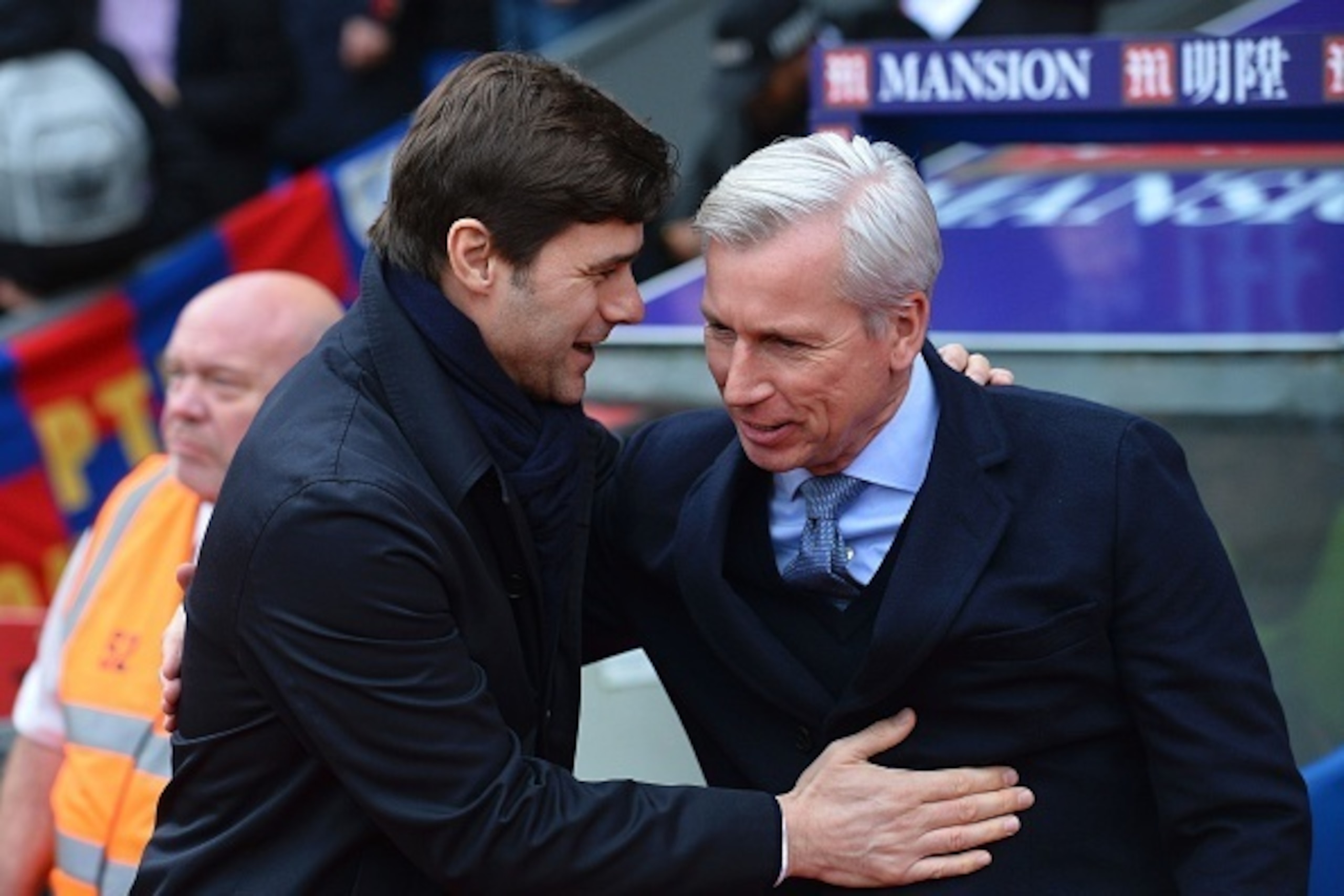 Crystal Palace's English manager Alan Pardew (R) greets Tottenham Hotspur's Argentinian head coach Mauricio Pochettino (L) before kick off of the English Premier League football match between Crystal Palace and Tottenham Hotspur at Selhurst Park in south 