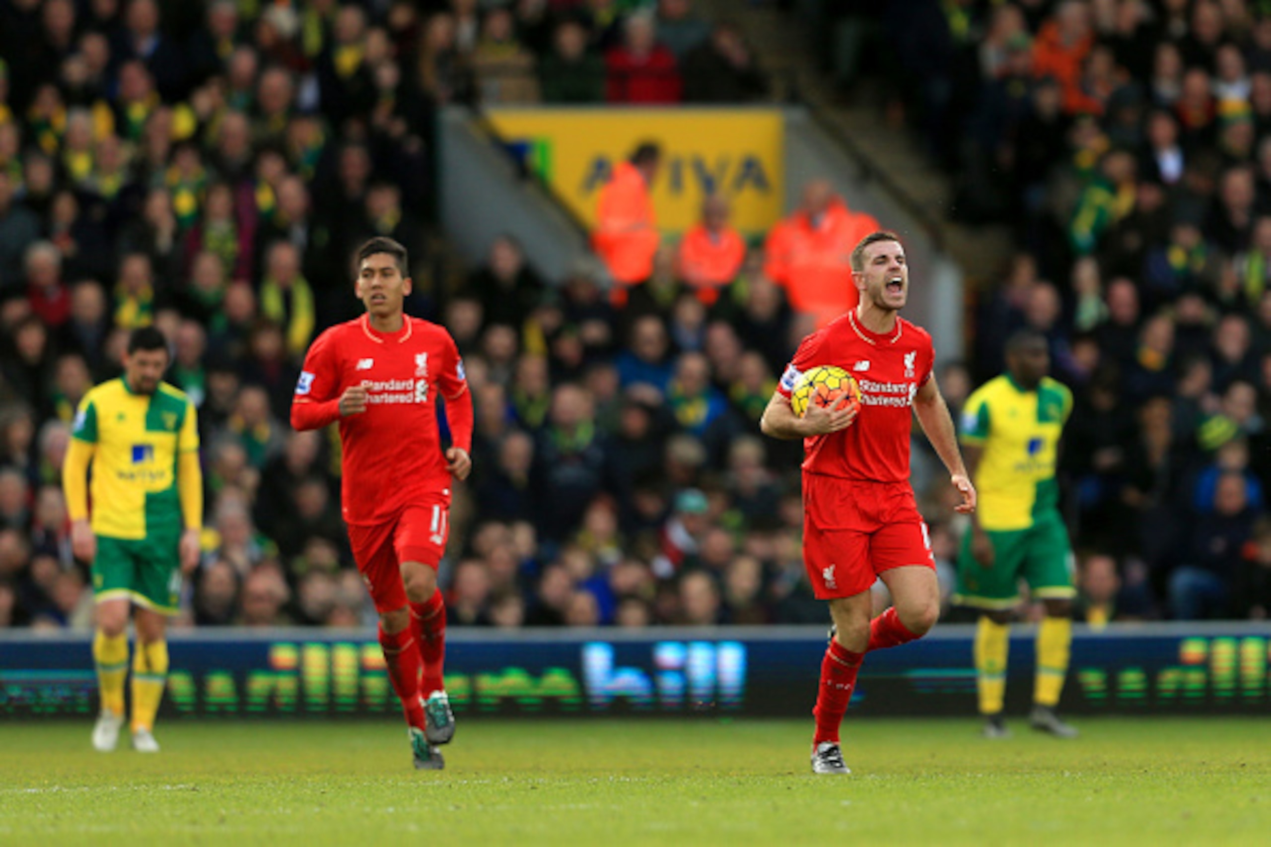 NORWICH, ENGLAND - JANUARY 23:  Jordan Henderson of Liverpool dashes to the central circle with the ball after scoring his team's second goal during the Barclays Premier League match between Norwich City and Liverpool at Carrow Road on January 23, 2016 in