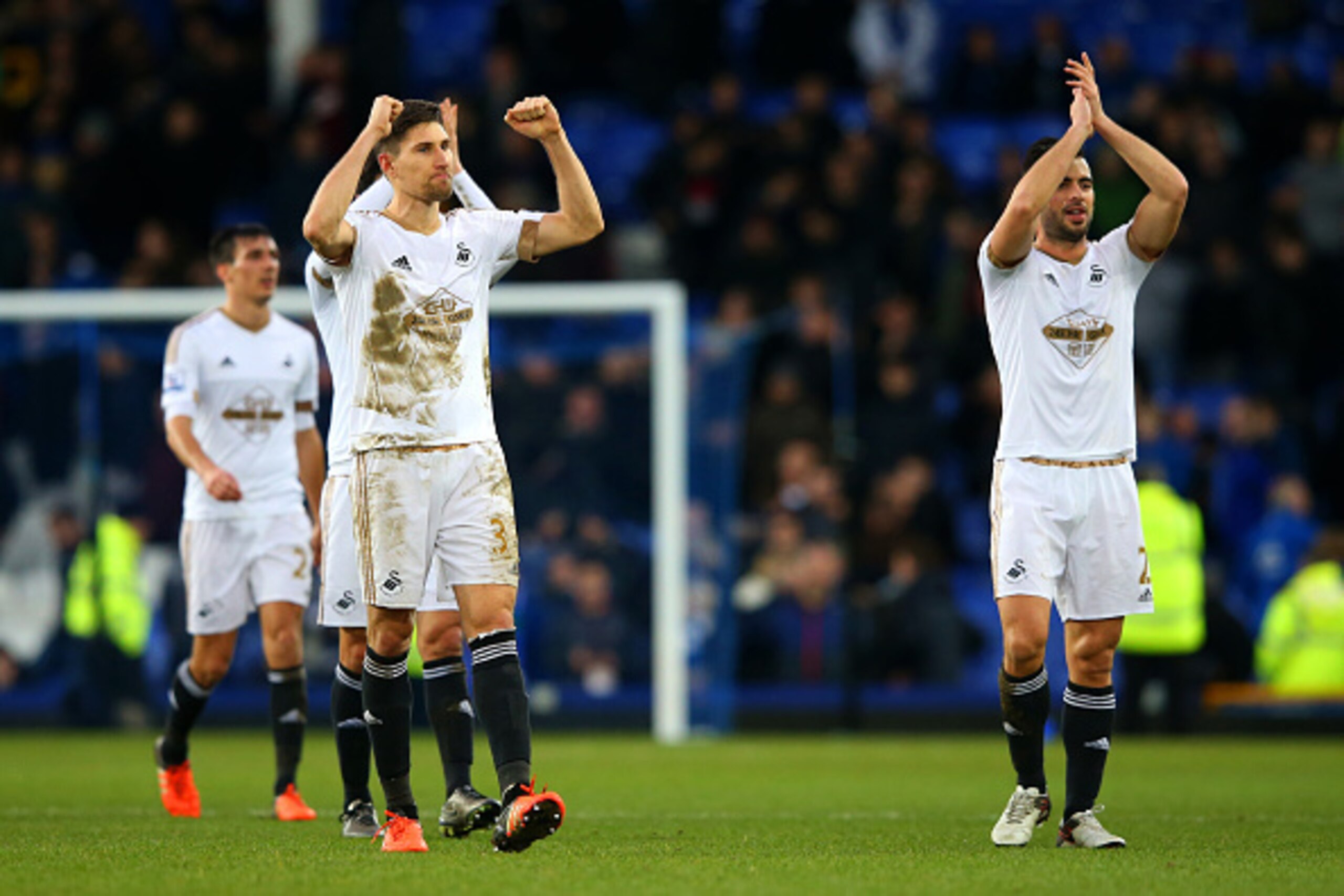 LIVERPOOL, ENGLAND - JANUARY 24:  Federico Fernandez and Jordi Amat of Swansea City applaud the fans as they celebrate victory in the Barclays Premier League match between Everton and Swansea City at Goodison Park on January 24, 2016 in Liverpool, England